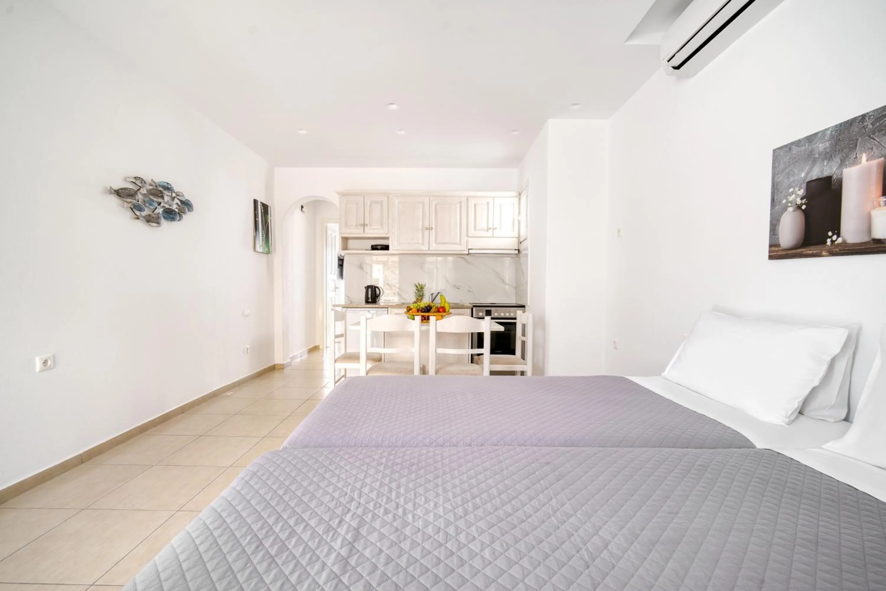 Bed in Anius Apartments