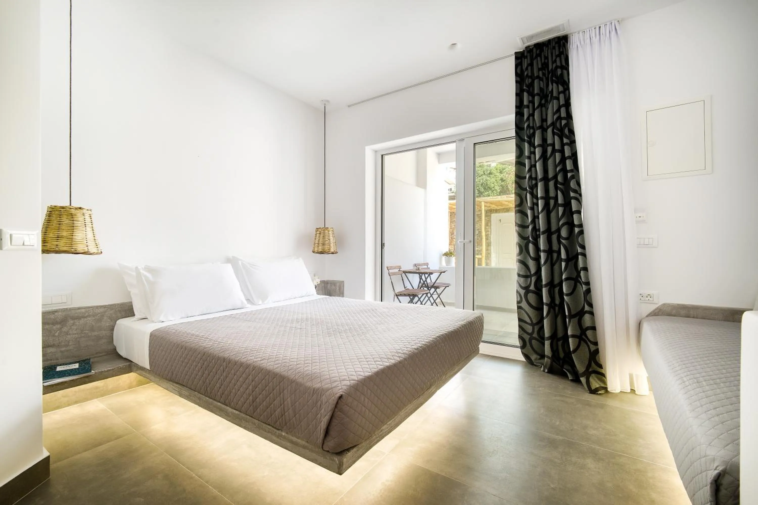 Bed in Anius Apartments