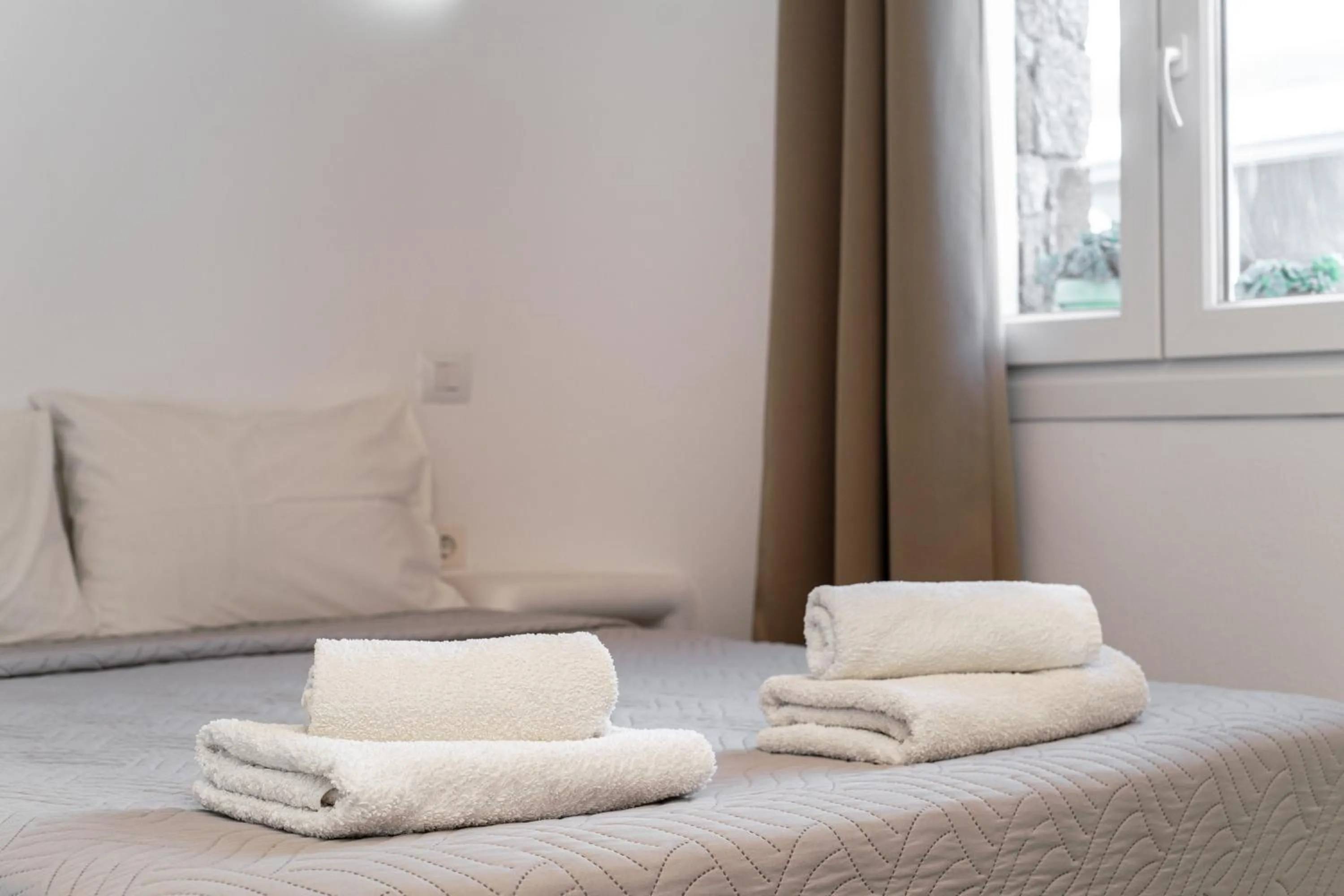 Bed in Anius Apartments