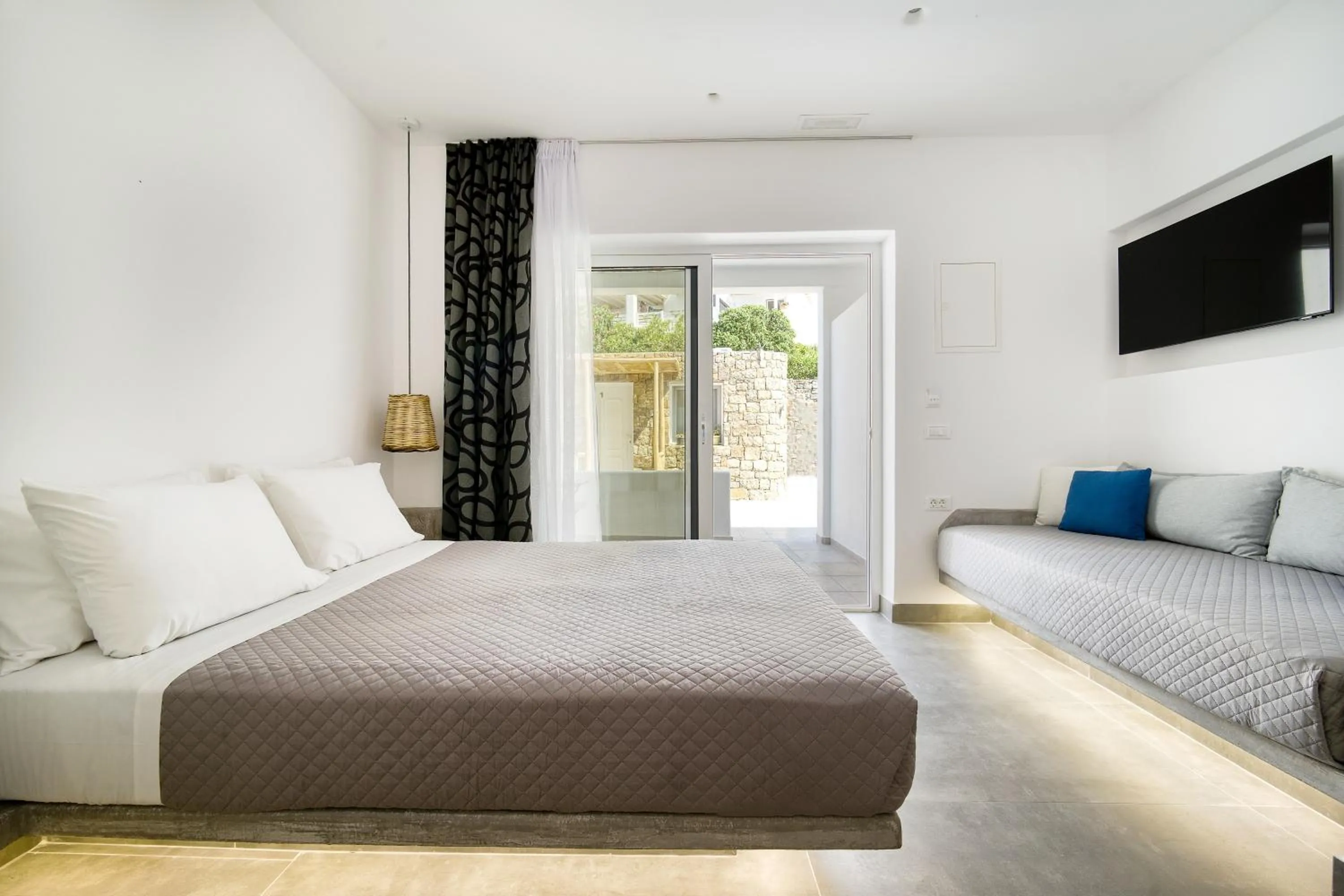 Bed in Anius Apartments