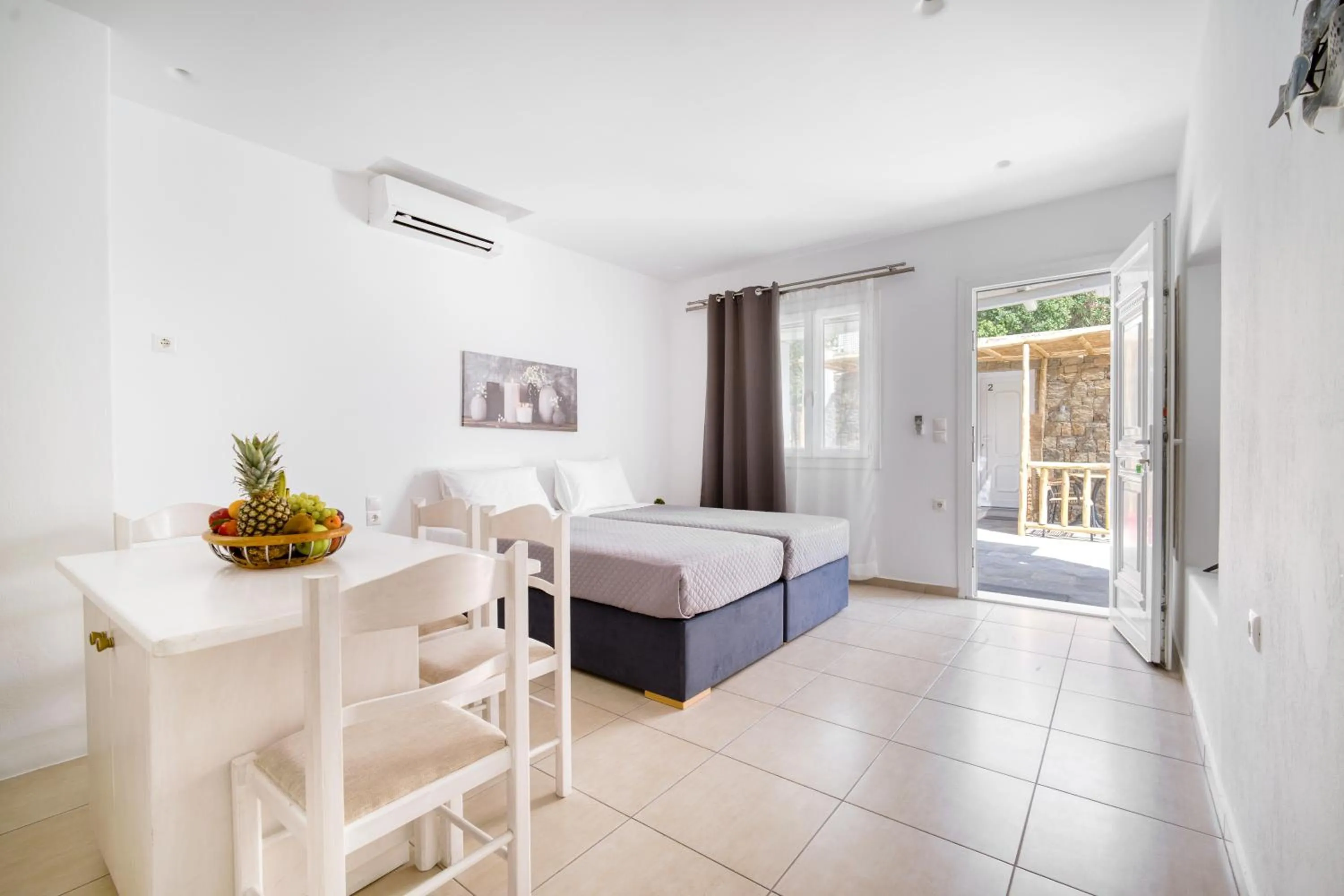 Bed in Anius Apartments