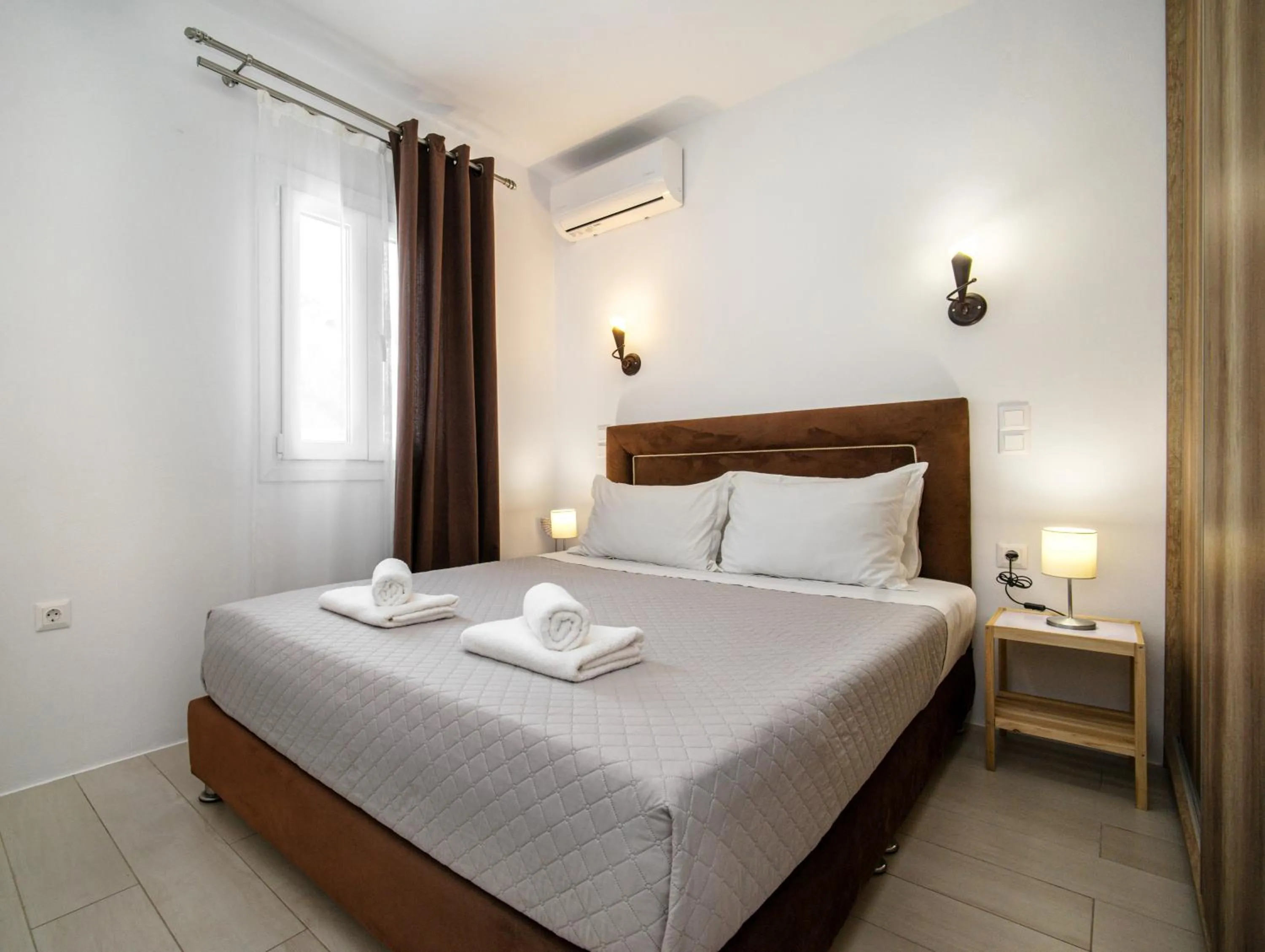 Bed in Anius Apartments