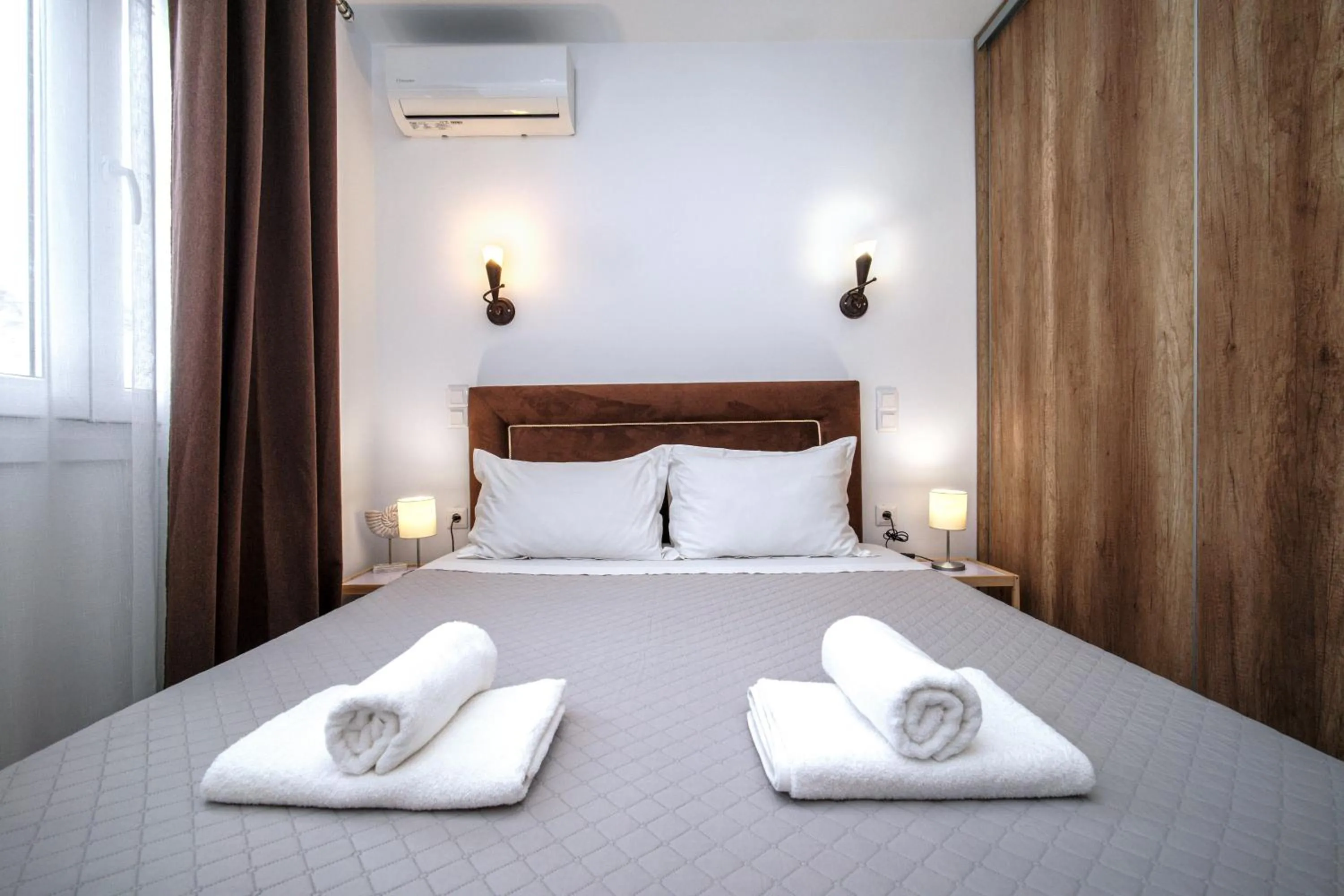 Bed in Anius Apartments