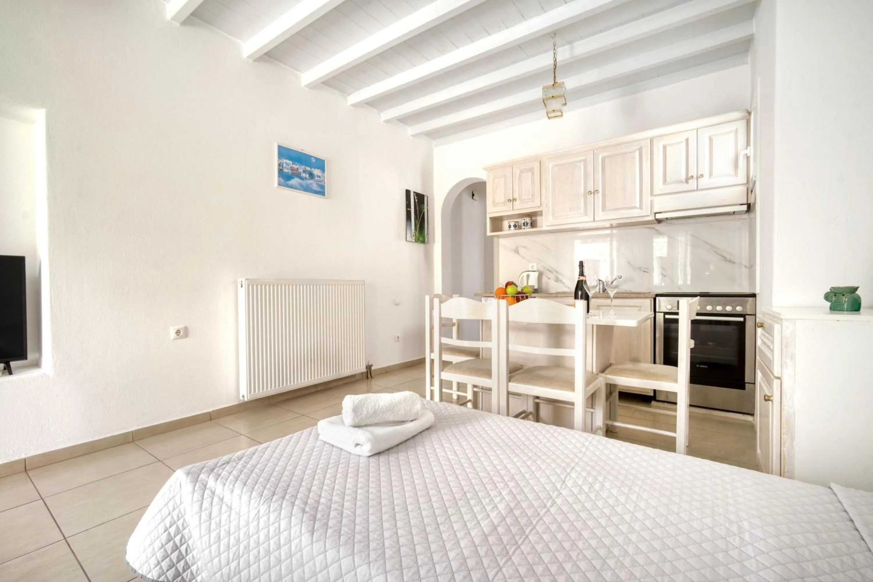 Bed in Anius Apartments