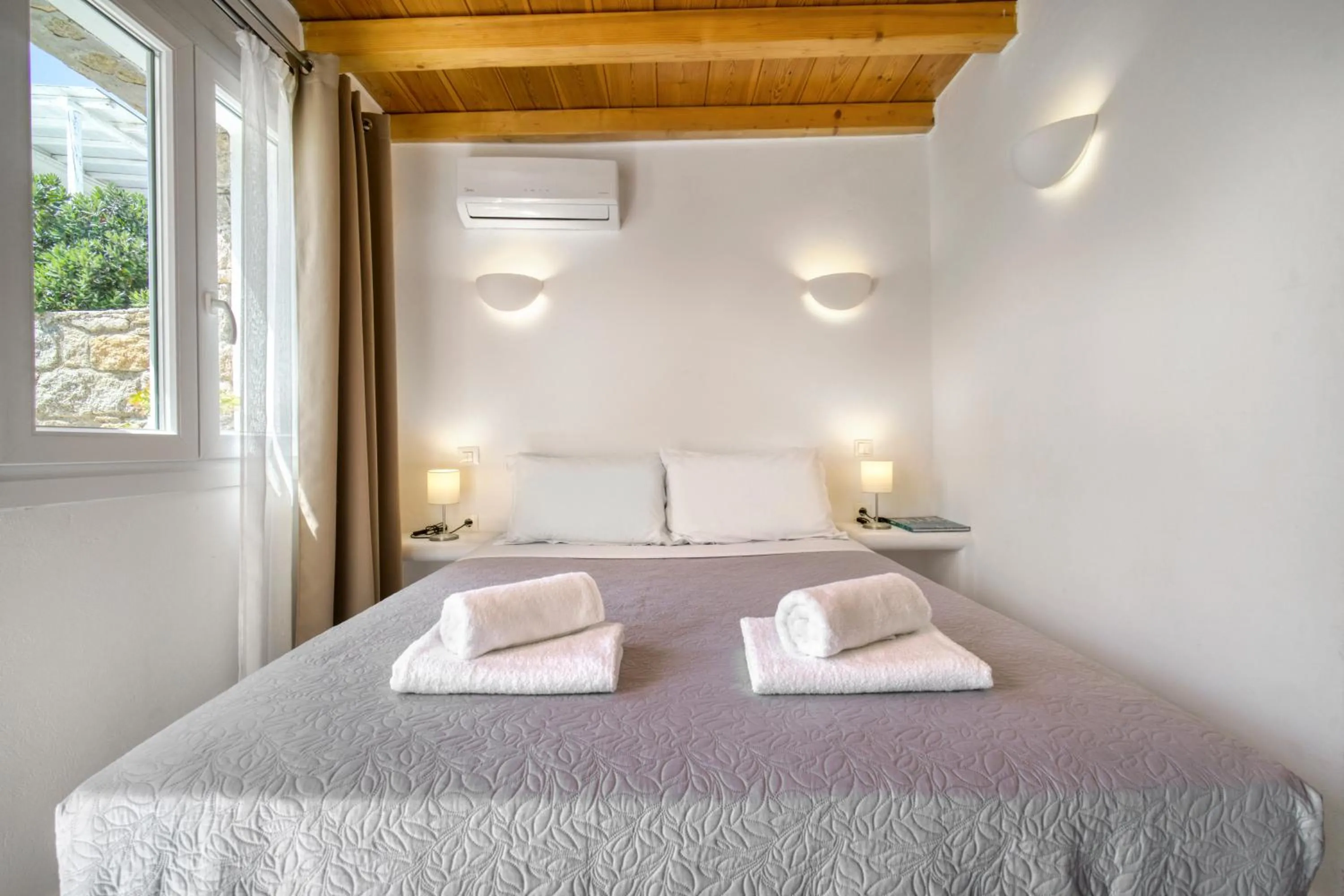 Bed in Anius Apartments