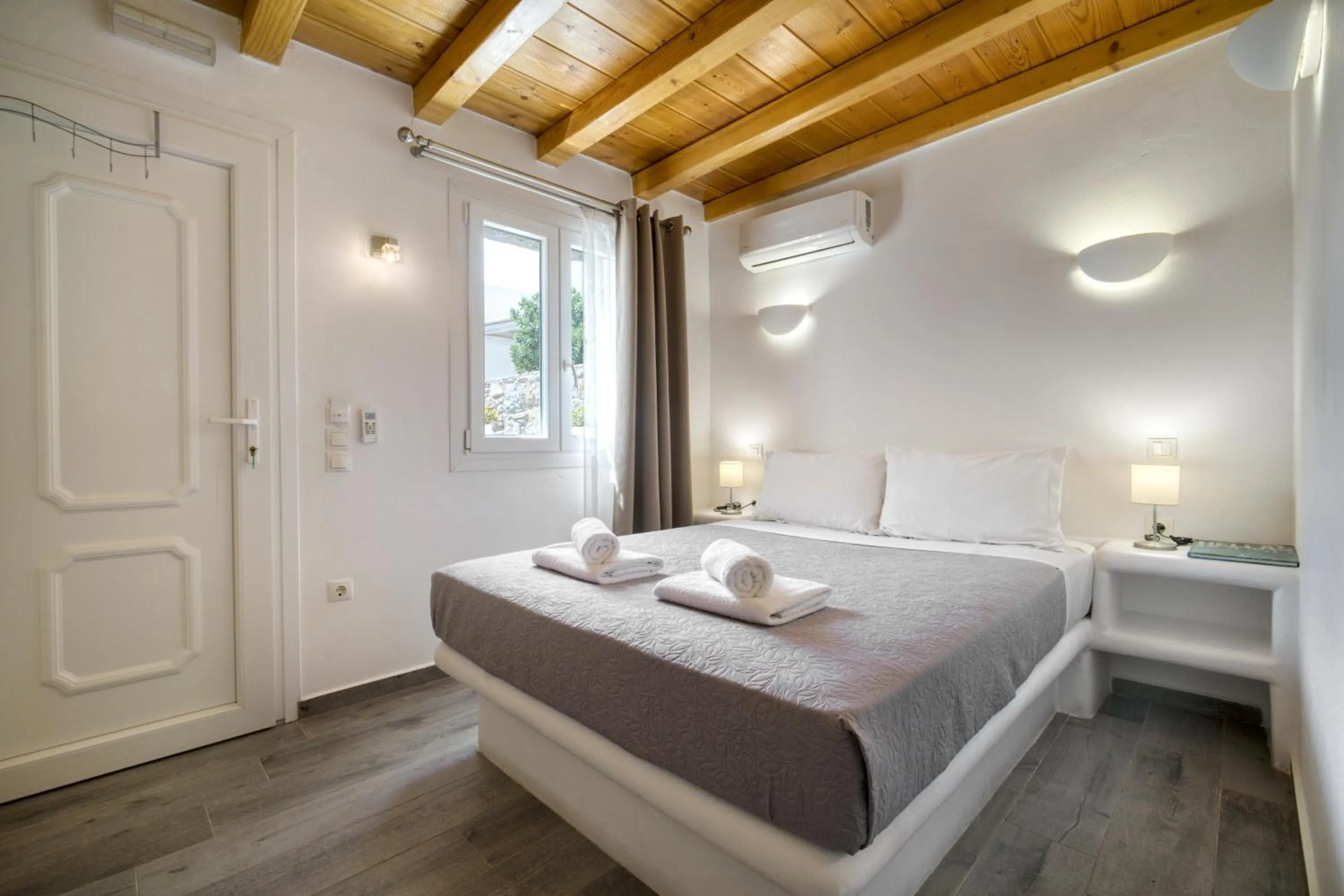 Bed in Anius Apartments