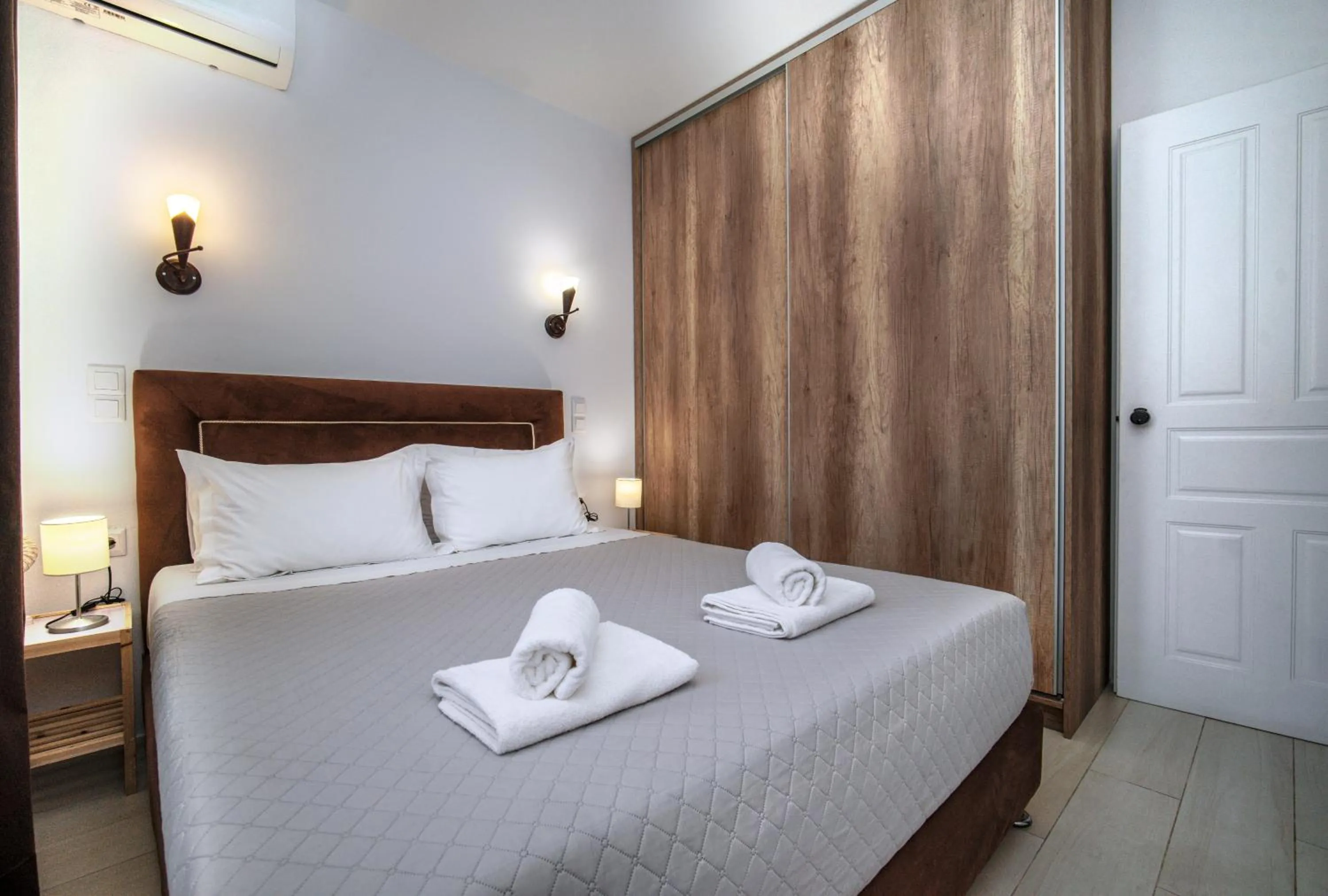 Bed in Anius Apartments