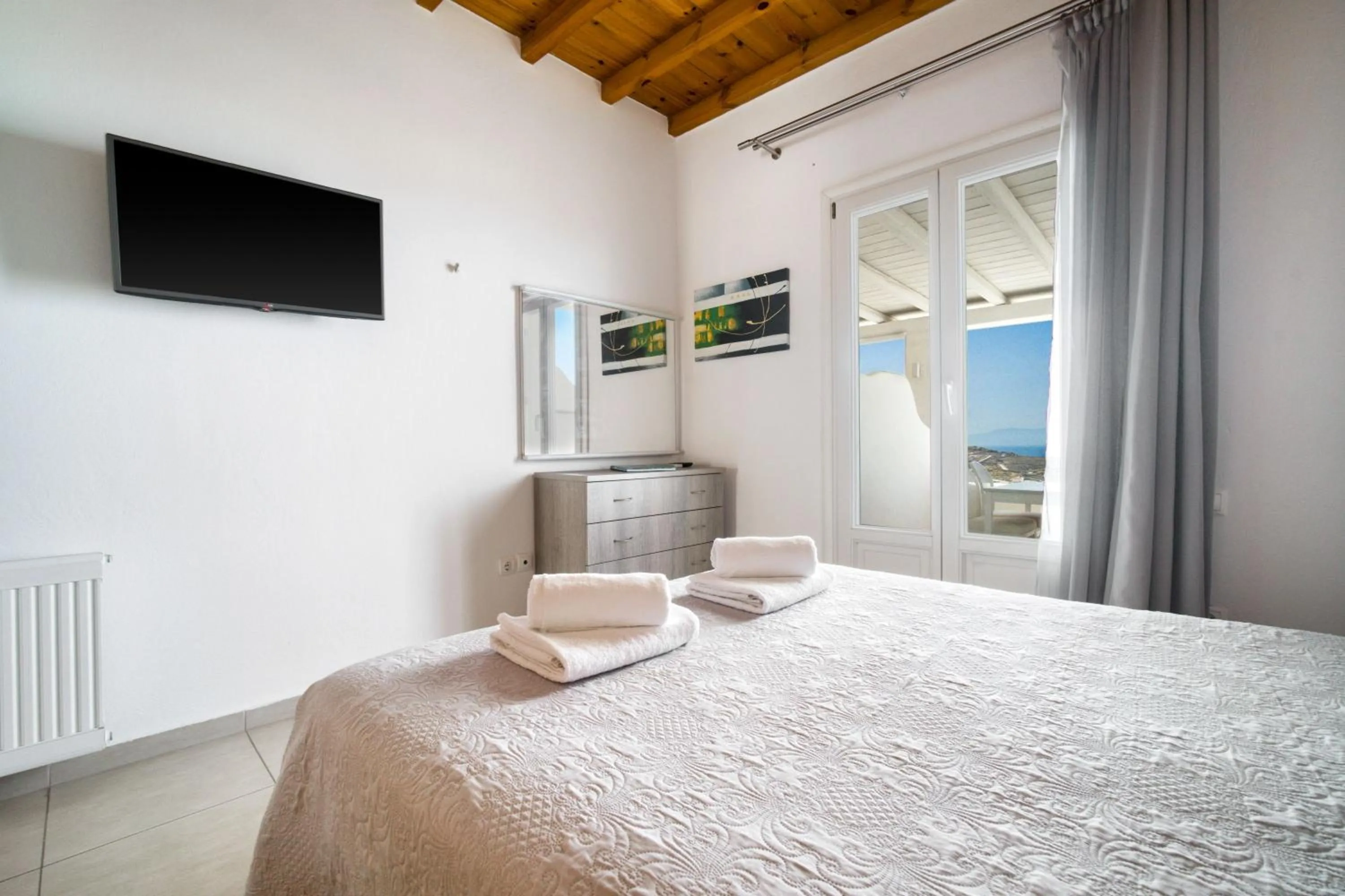 Bed in Anius Apartments