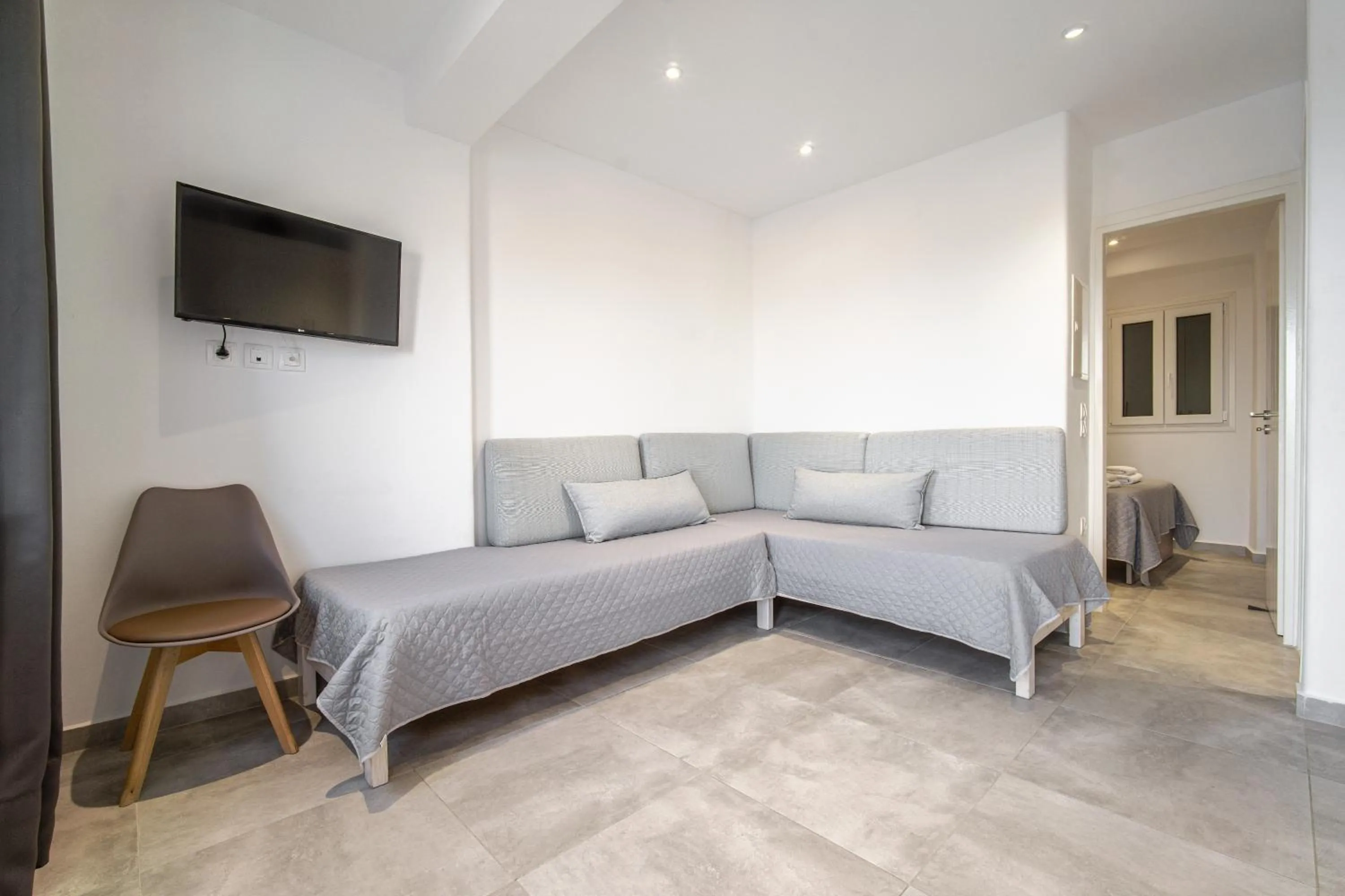 Bed in Anius Apartments