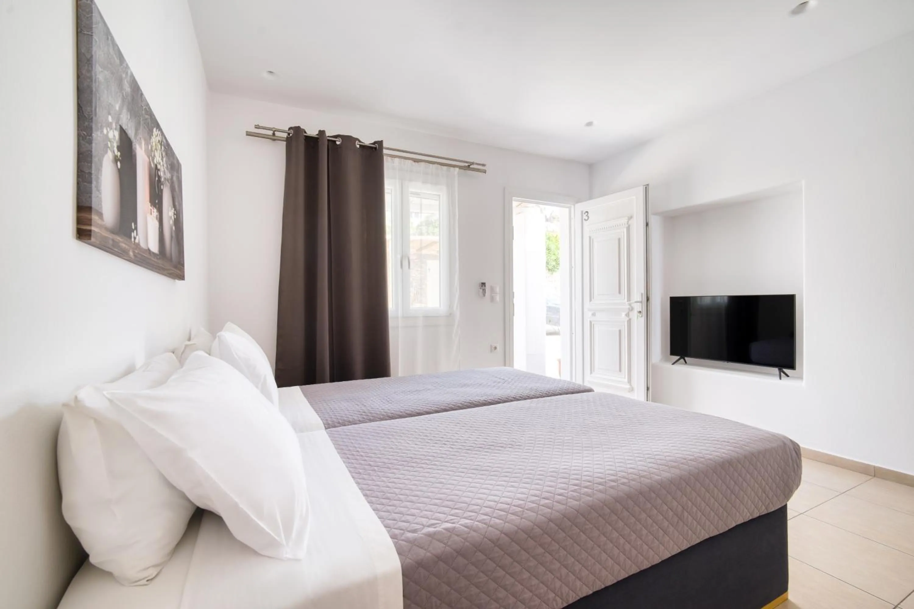 Bed in Anius Apartments