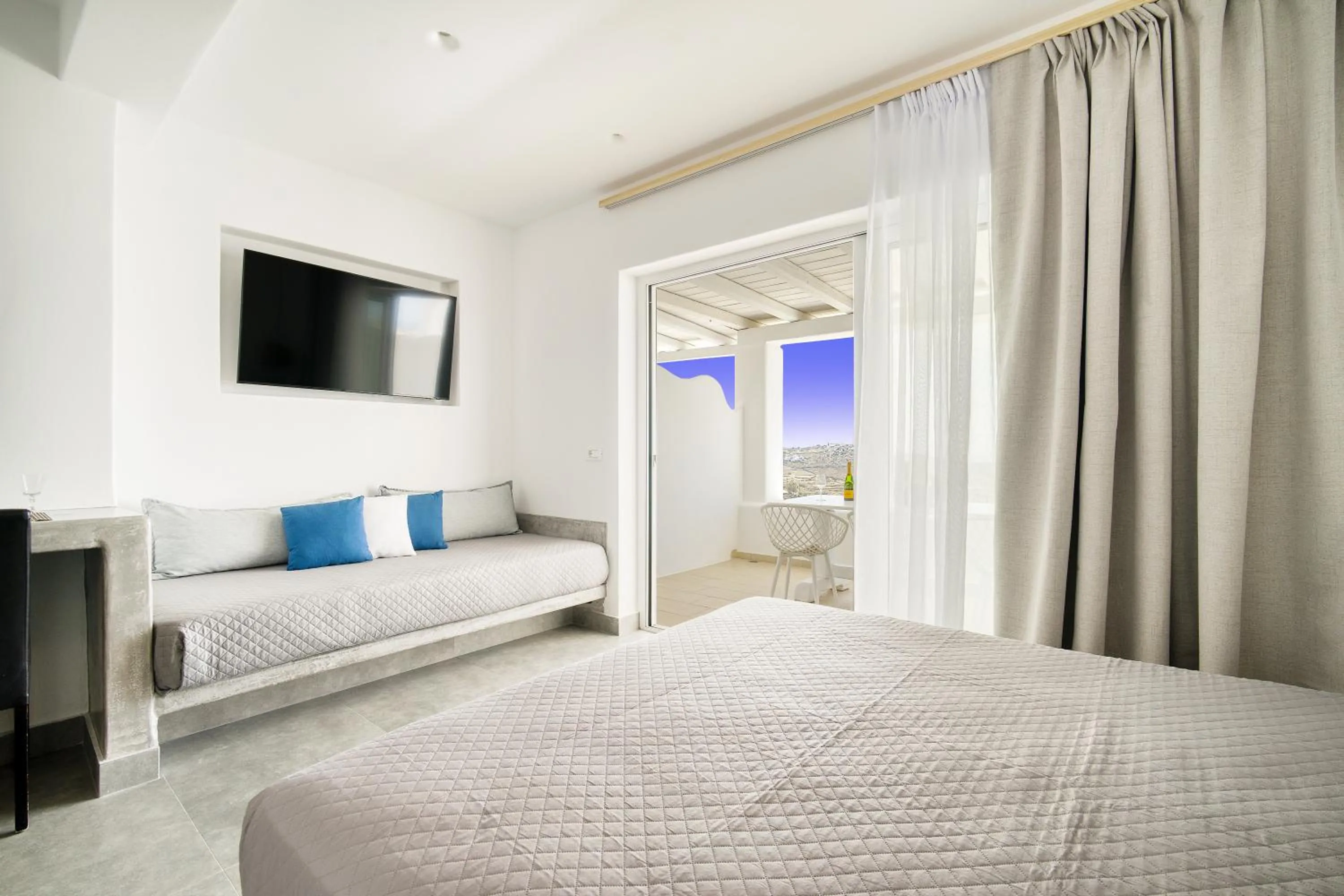 Bed in Anius Apartments