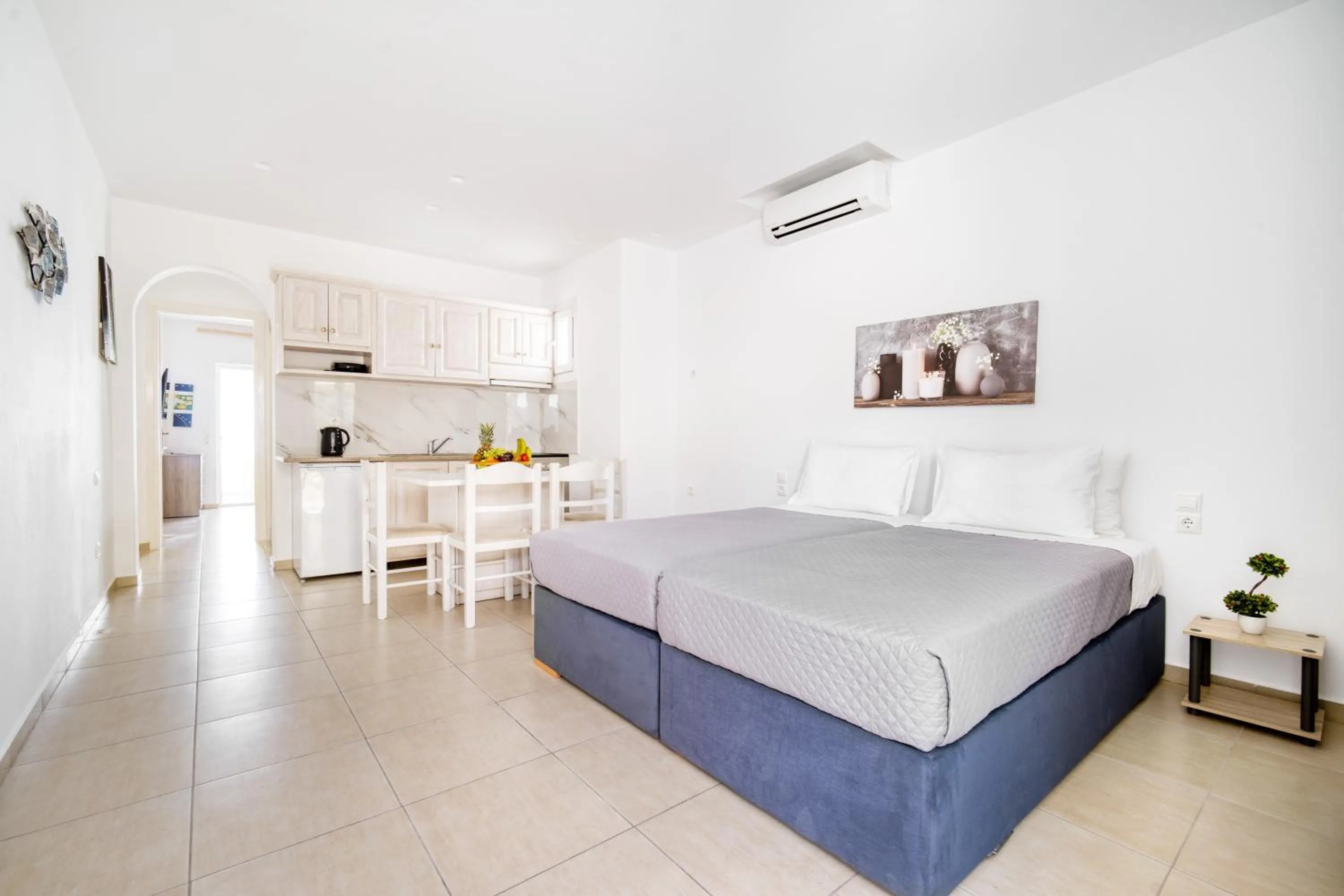 Bed in Anius Apartments