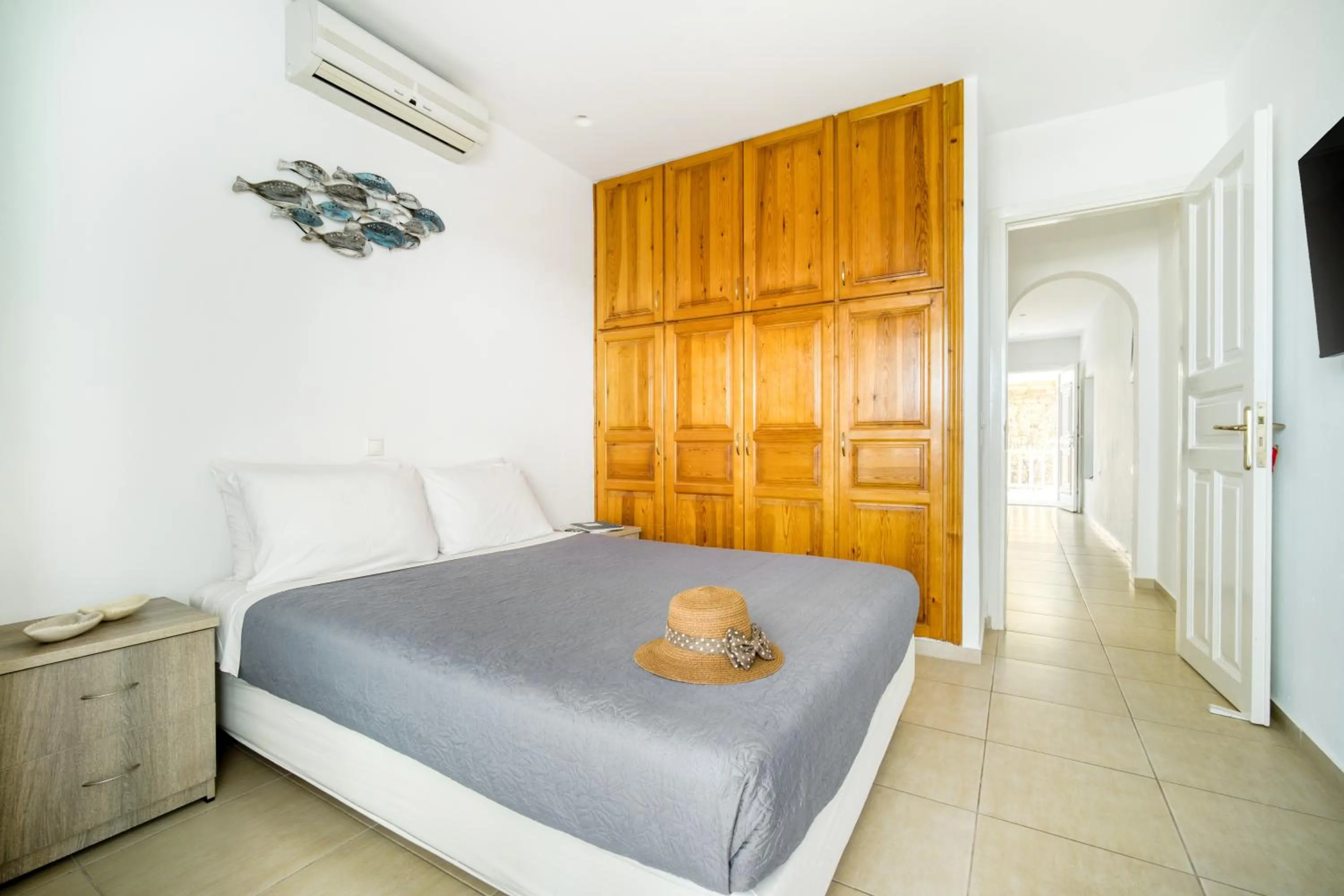 Bed in Anius Apartments