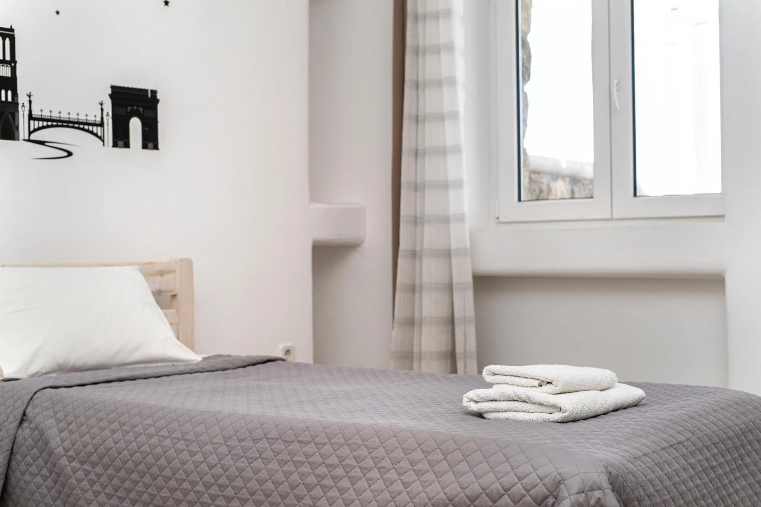 Bed in Anius Apartments