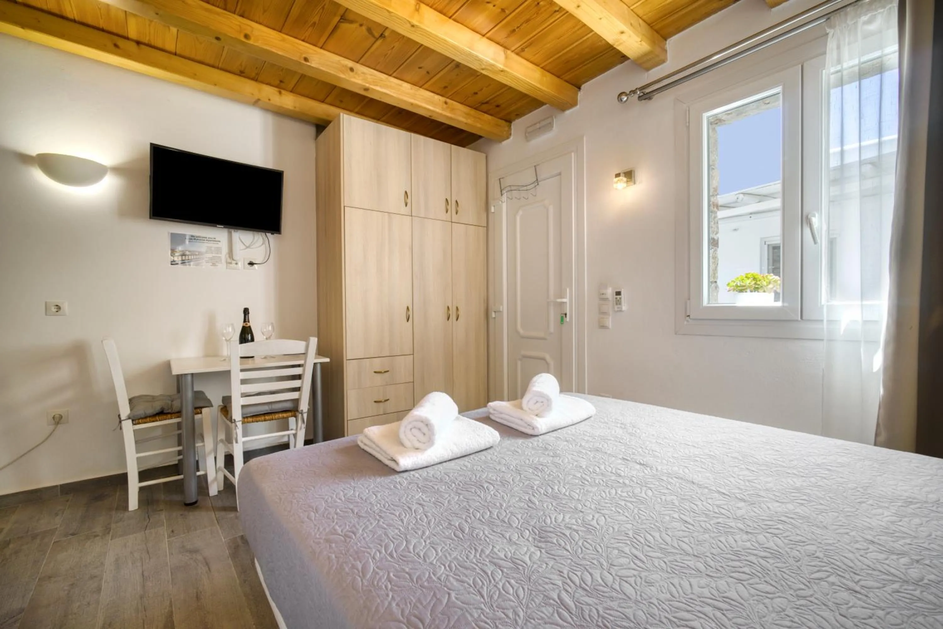 Bed in Anius Apartments