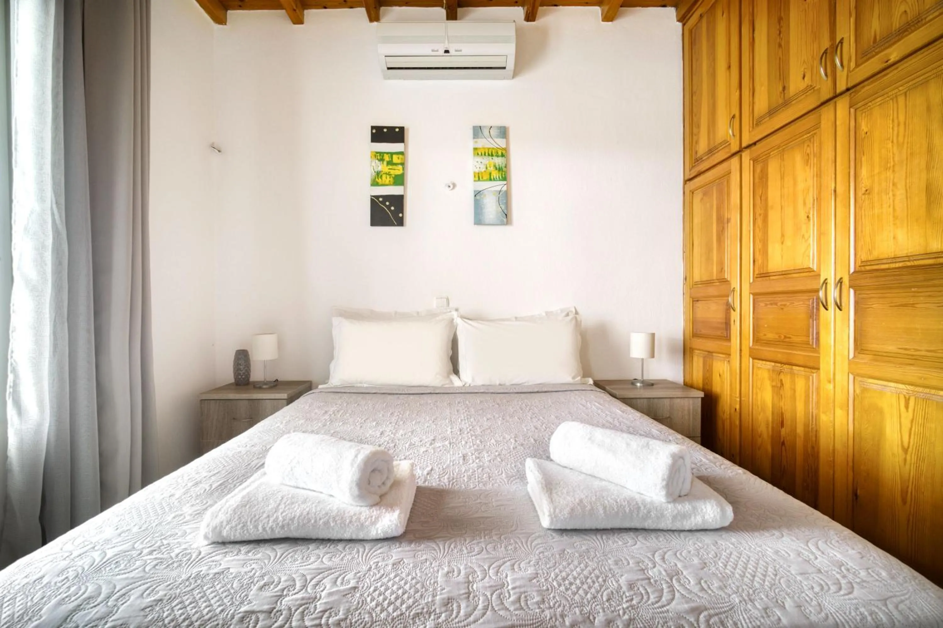 Bed in Anius Apartments