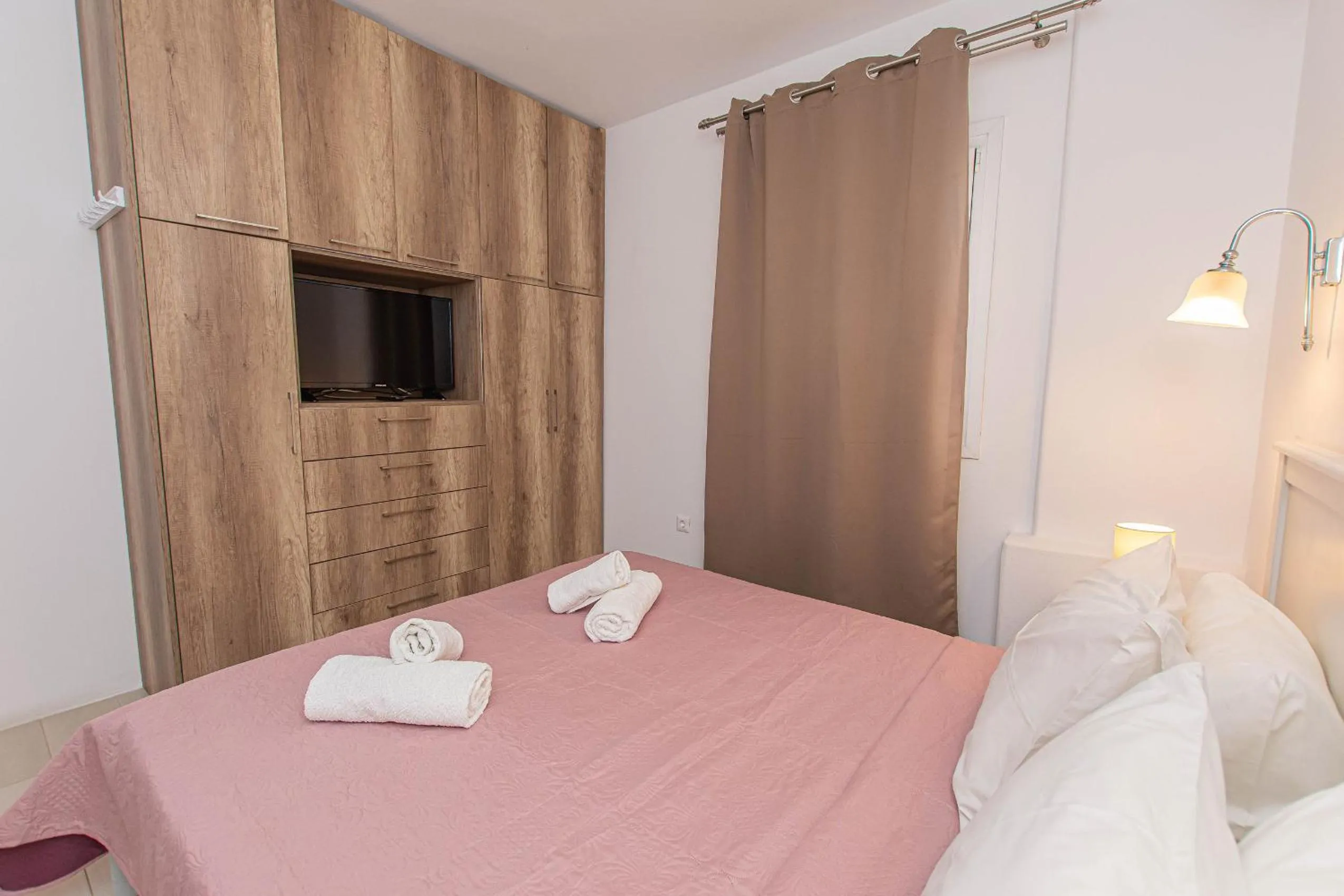 Bed in Anius Apartments