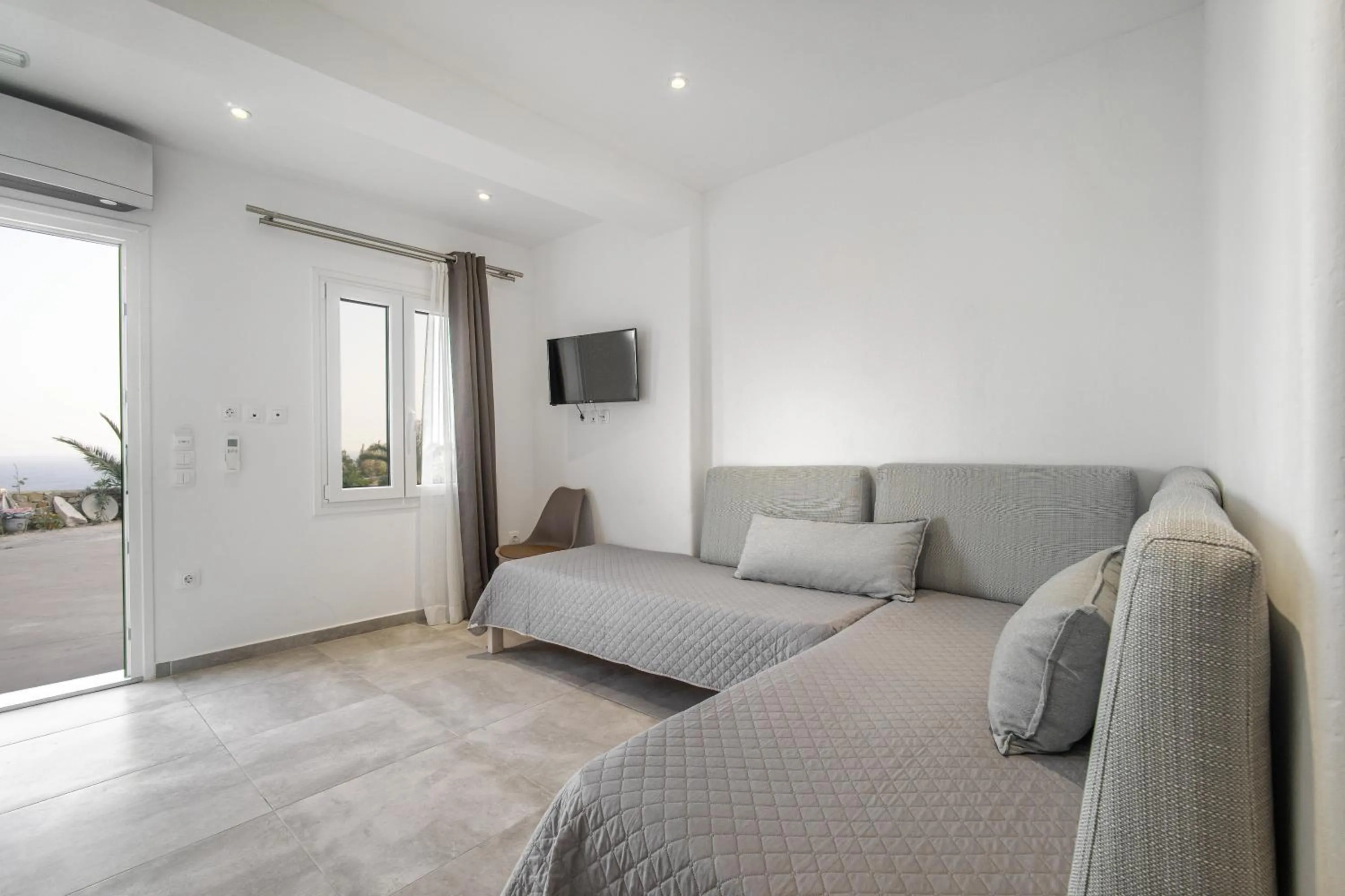 Bed in Anius Apartments