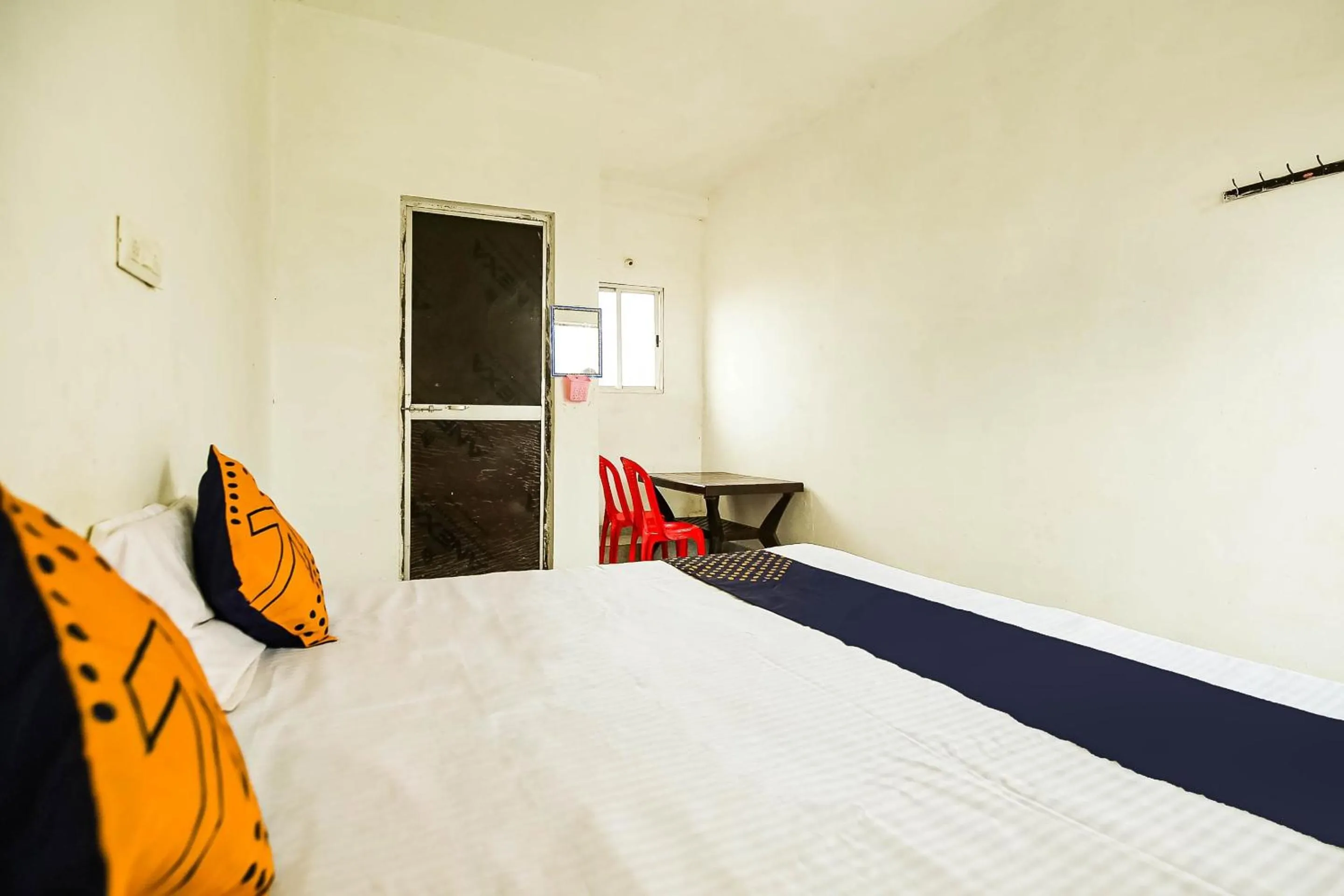 Bedroom, Bed in SPOT ON by OYO Krishna Market And Lodge