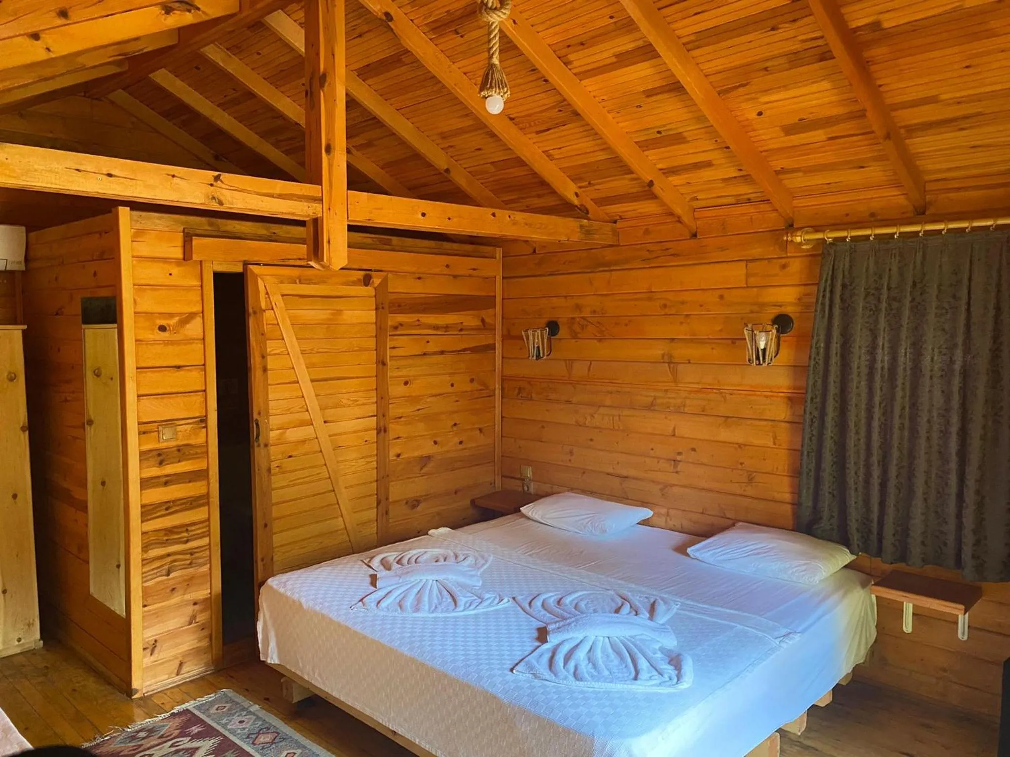 Bed in Green Pine Bungalows & Beach Luxury Concept