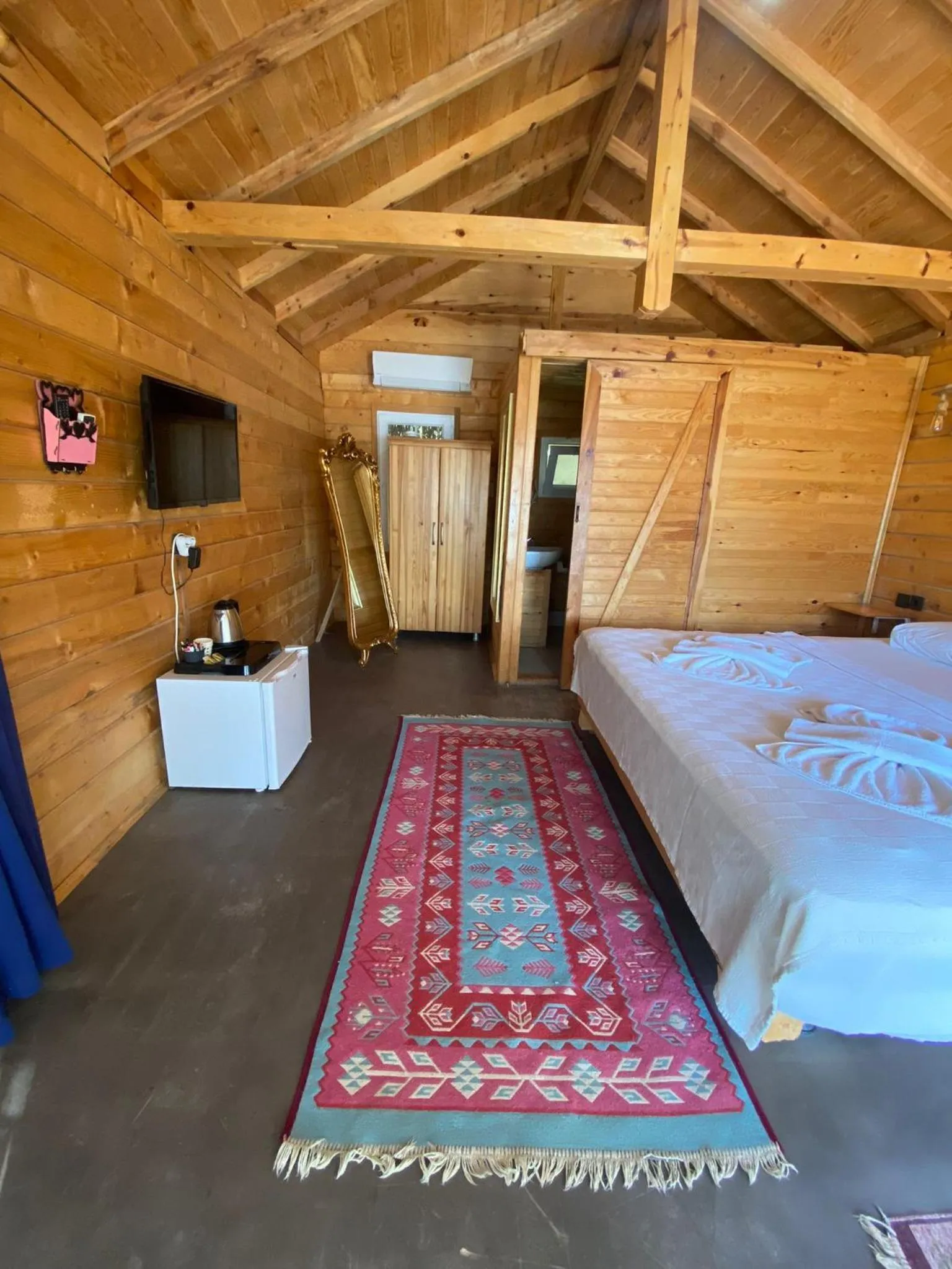 Bed in Green Pine Bungalows & Beach Luxury Concept