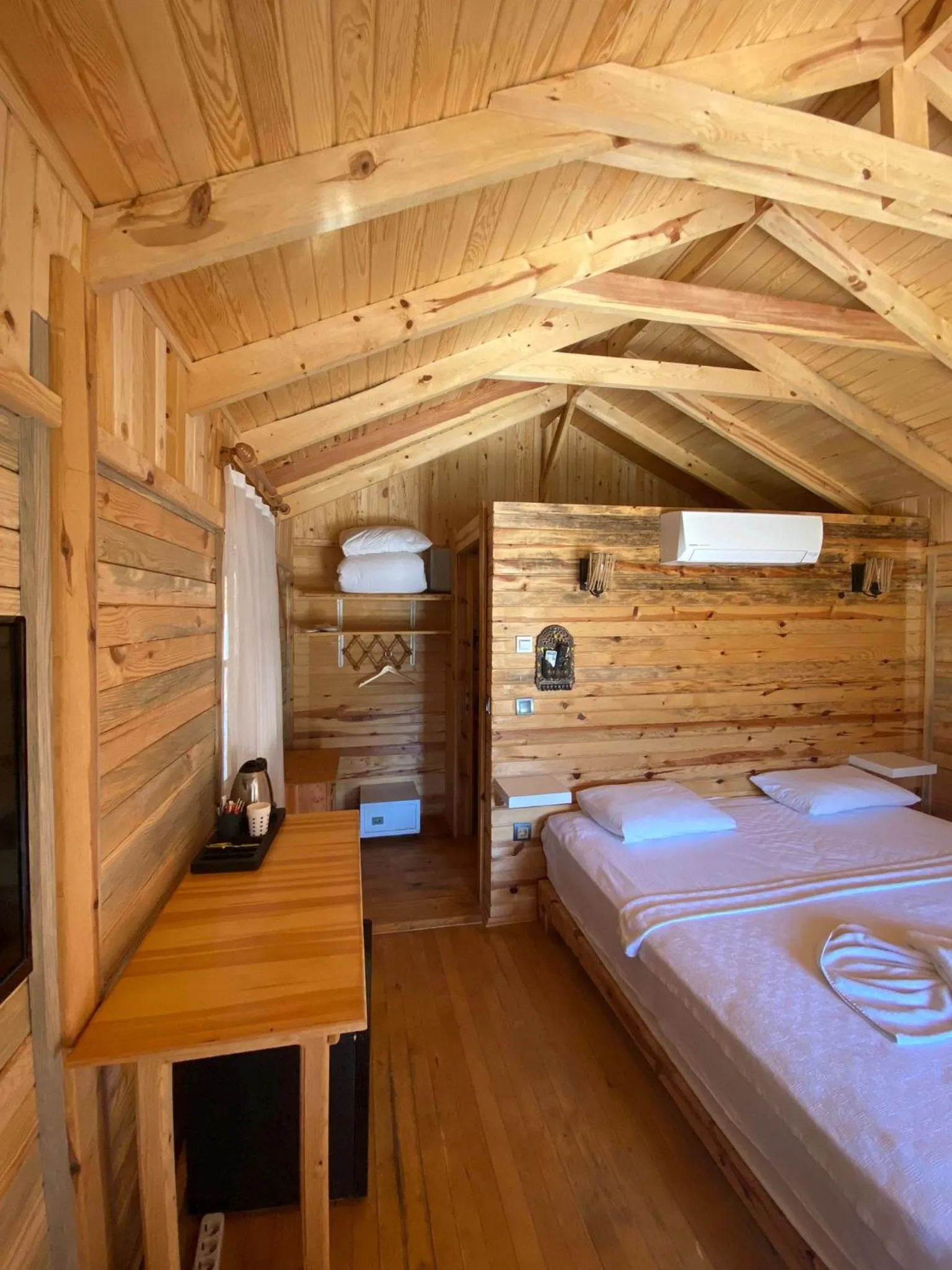 Bed in Green Pine Bungalows & Beach Luxury Concept