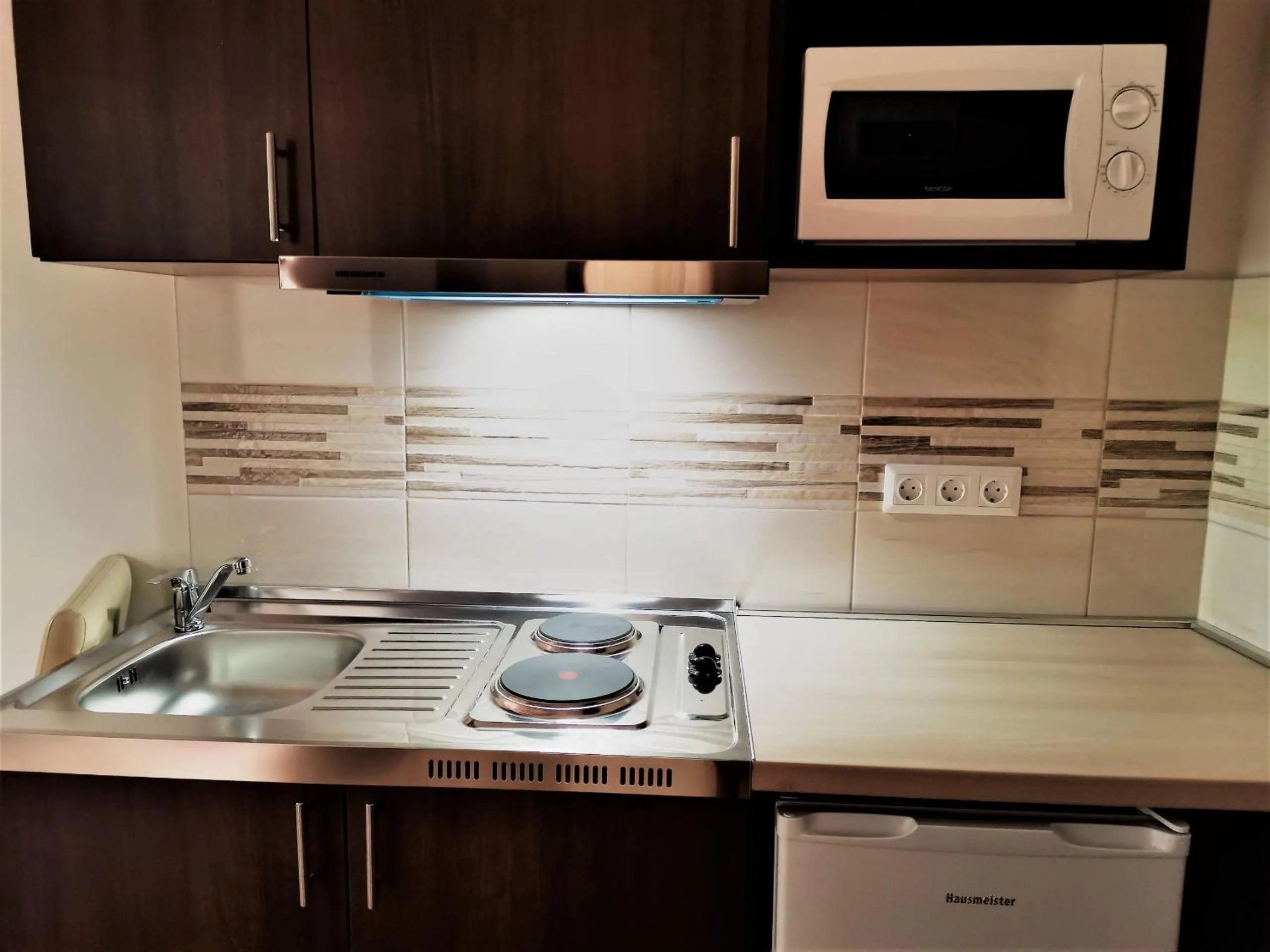 Kitchen or kitchenette in Termál Apartmanház