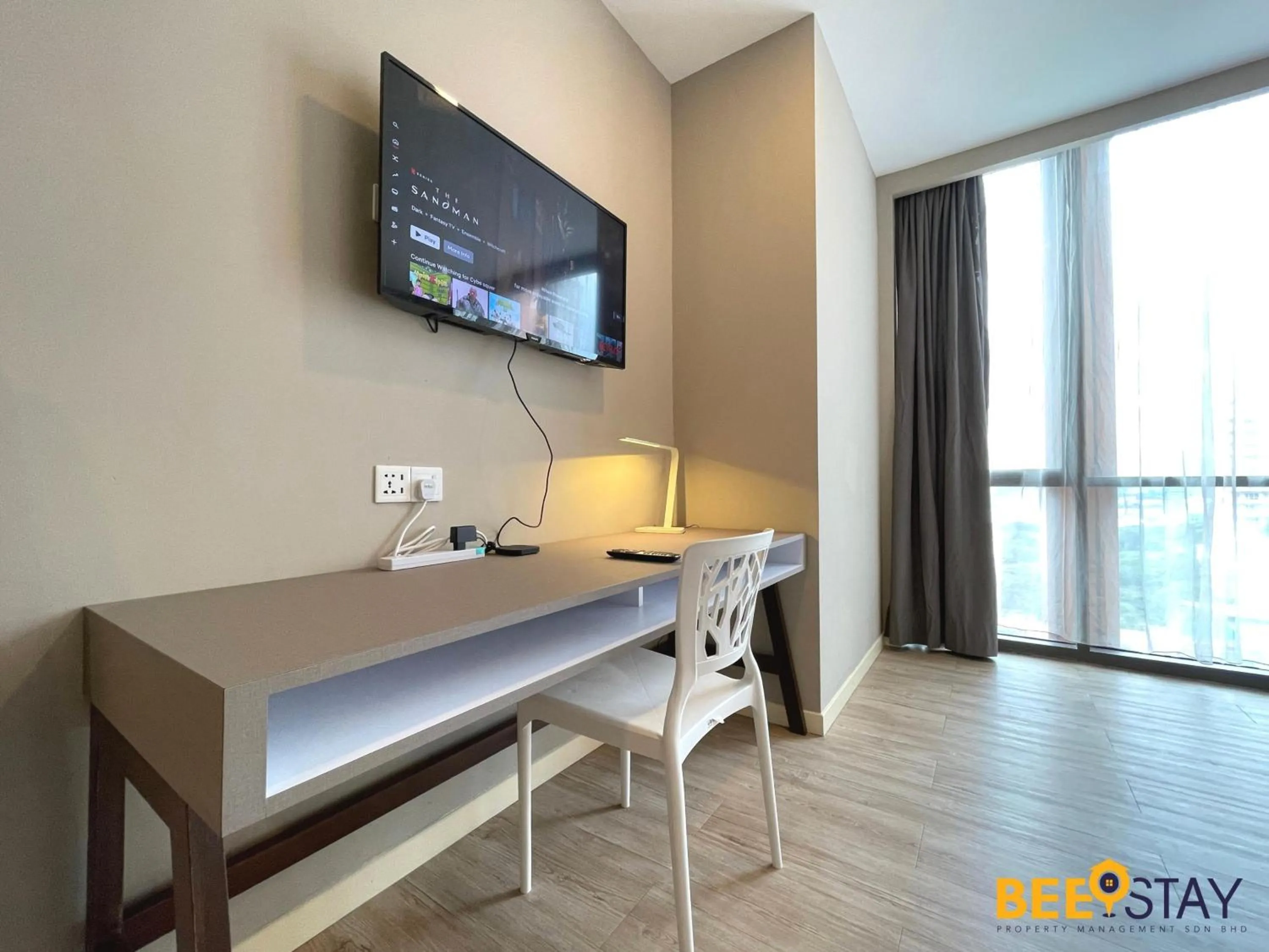 Communal lounge/ TV room in Empire Damansara Hotel Suites by Beestay