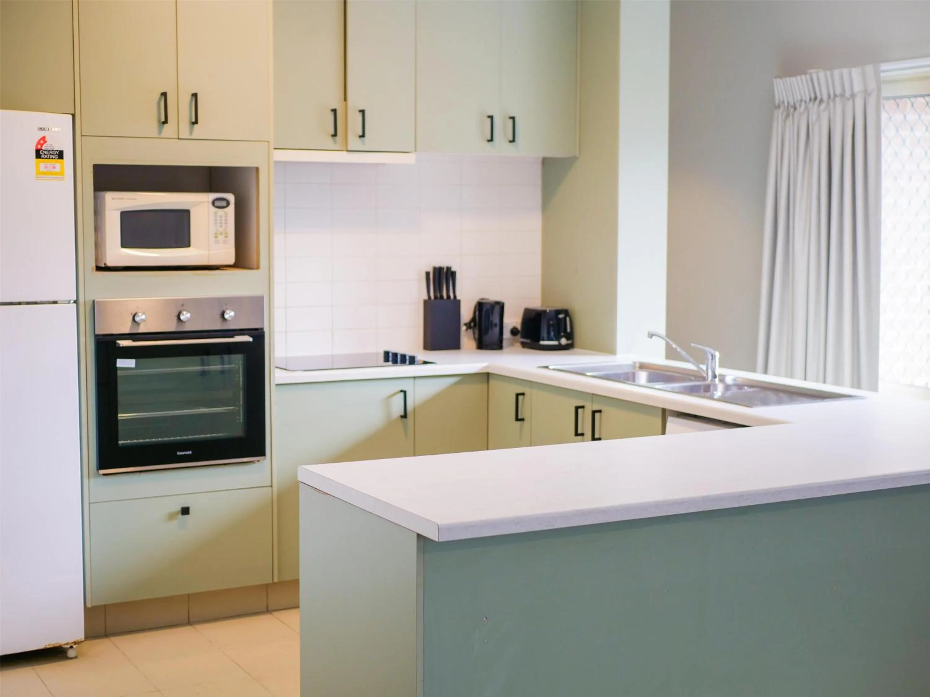 Kitchen or kitchenette in Nightcap at Hinterland Hotel Nerang