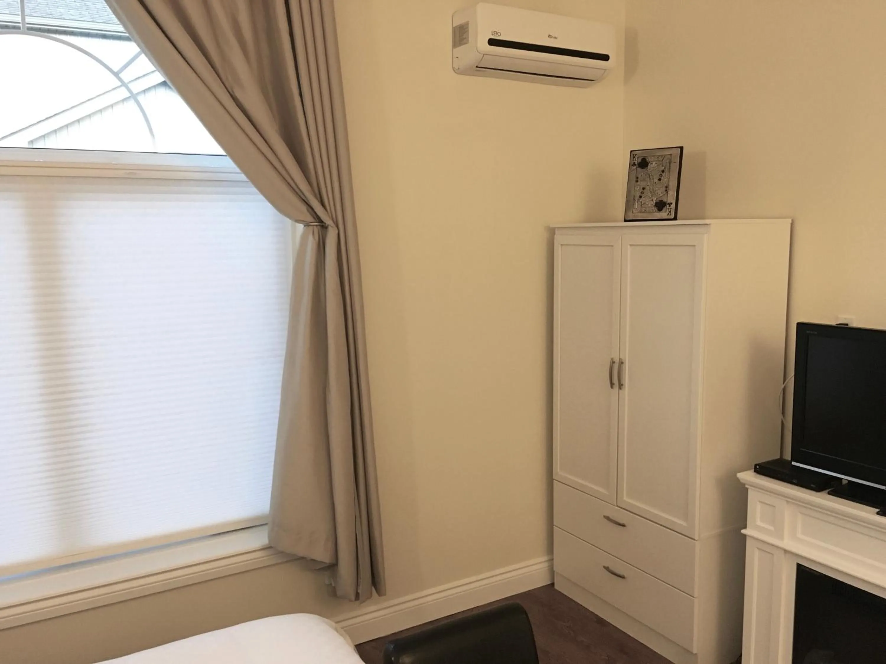 Bed in Grey Rose Suites