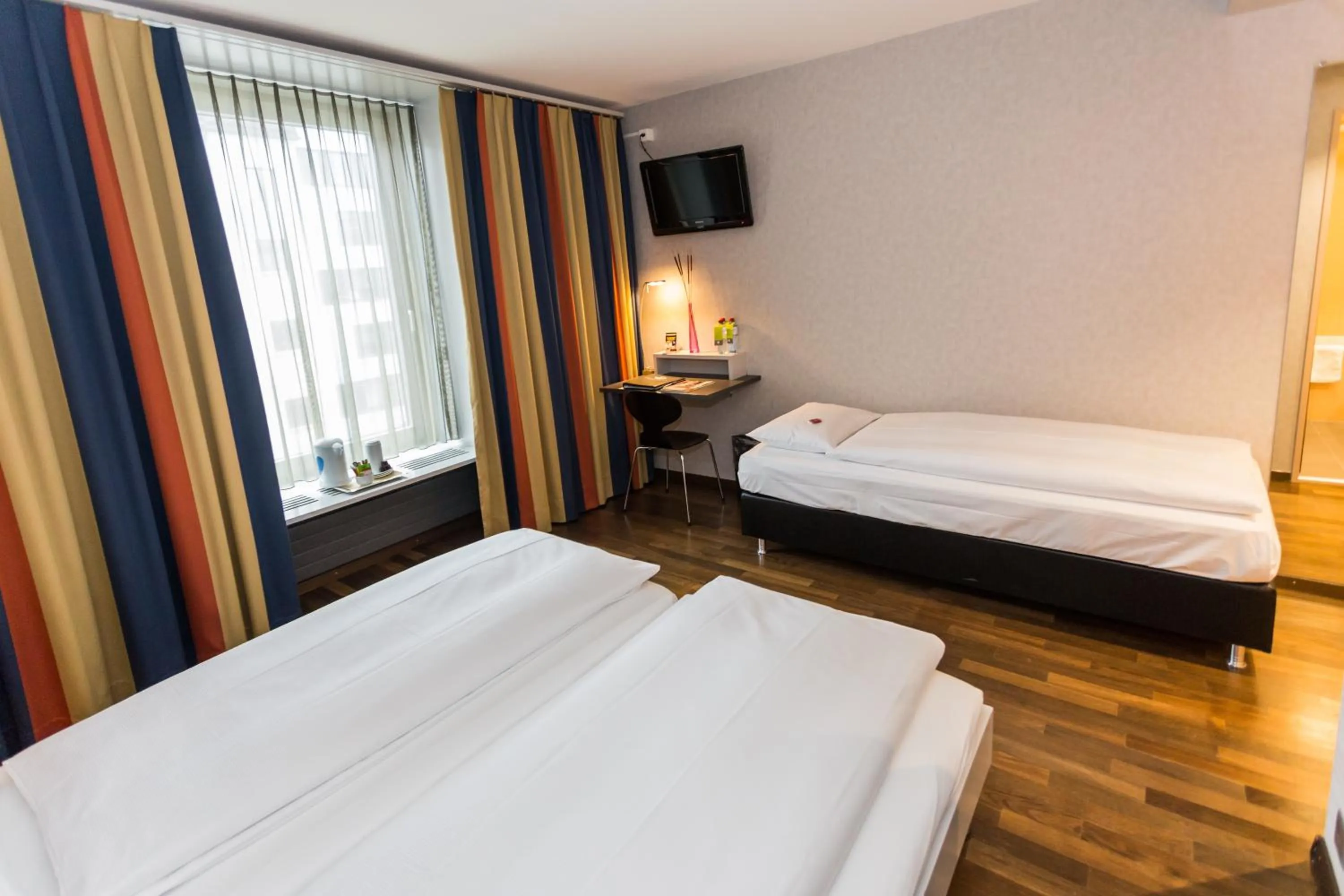 Photo of the whole room, Bed in Sorell Business Hotel Ador Bern