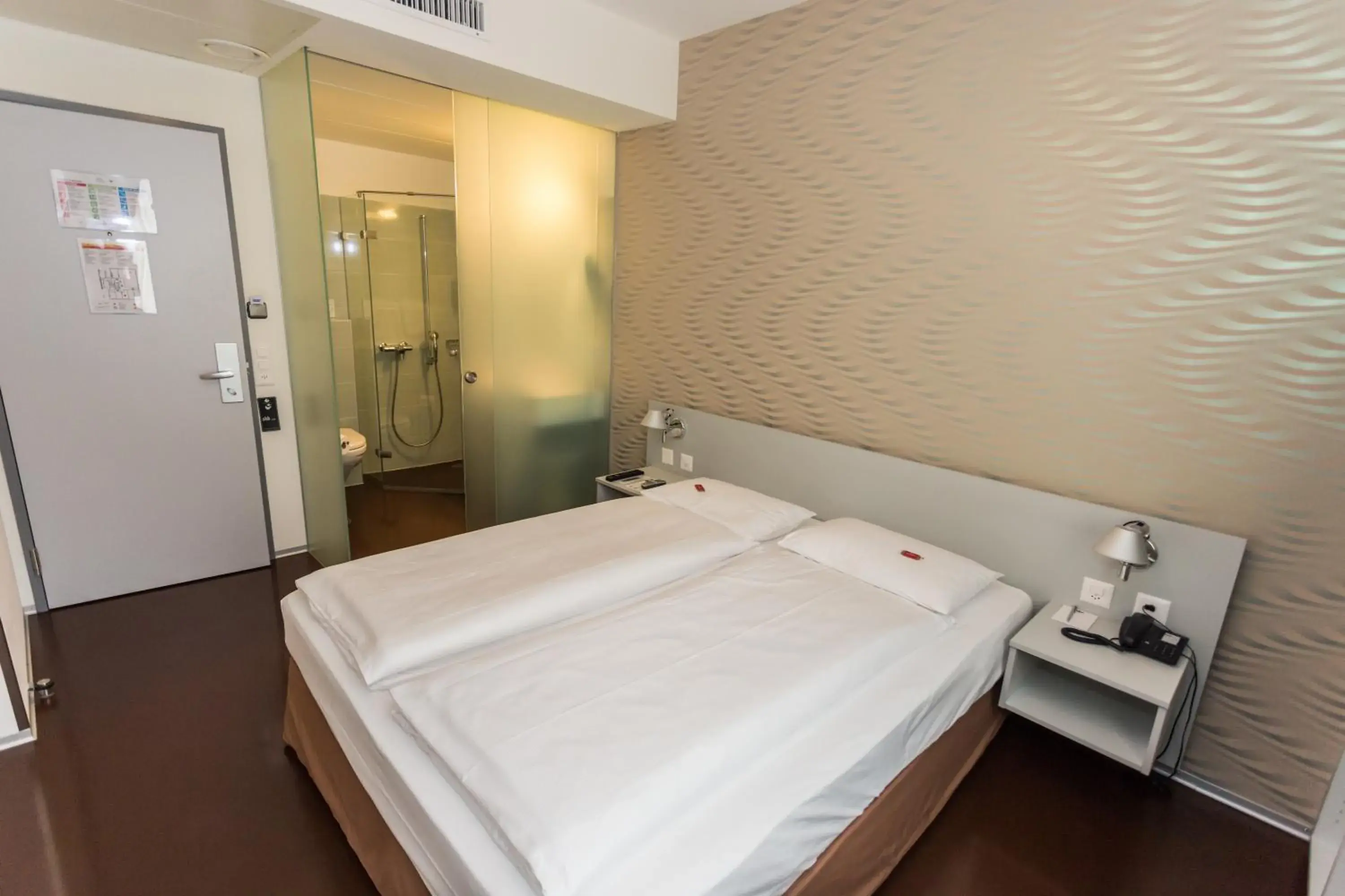 Bed in Sorell Business Hotel Ador Bern Bed in Sorell Business Hotel Ador Bern