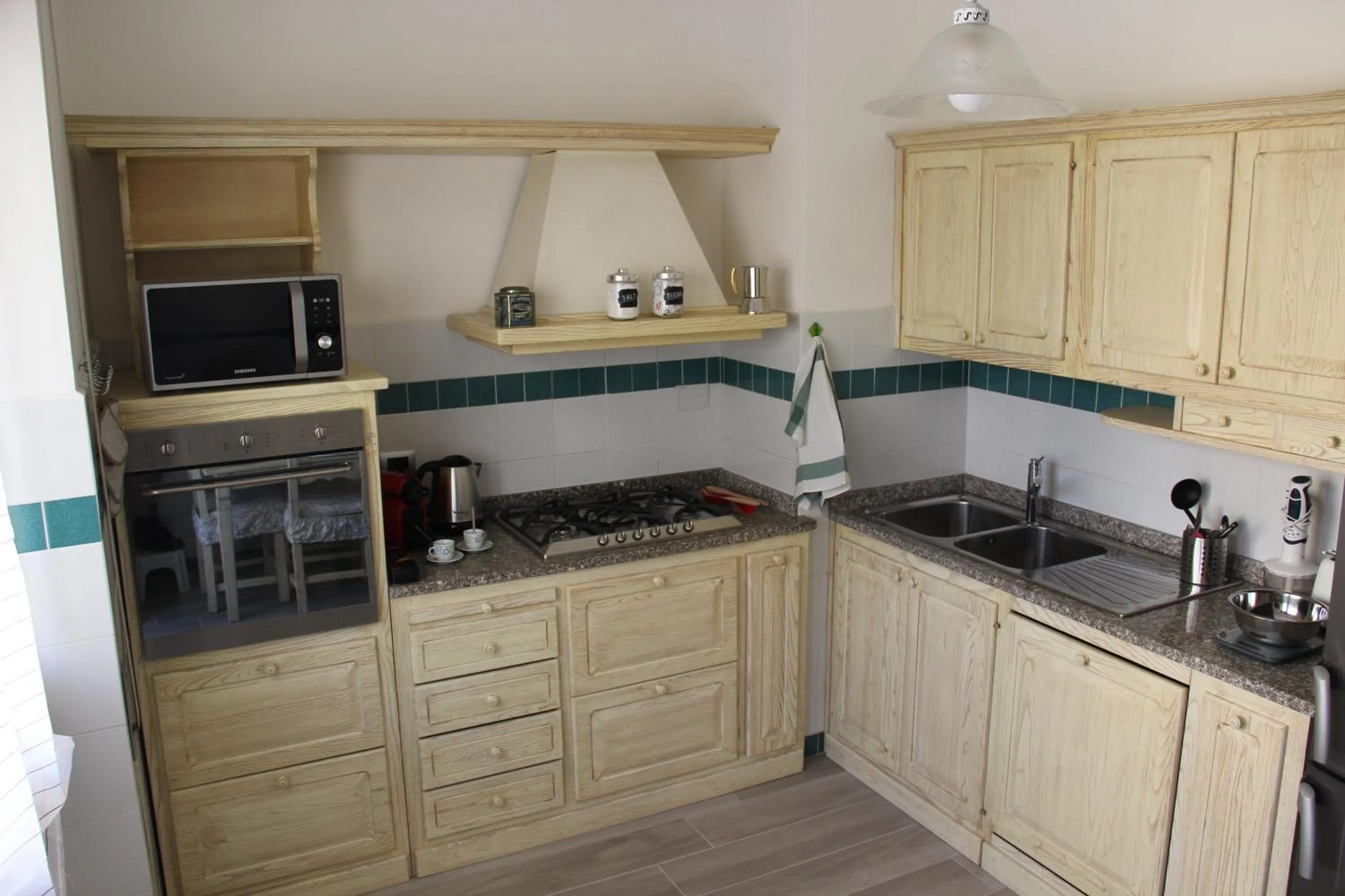 Kitchen or kitchenette in Appartamento Via dei Fabbri Navali