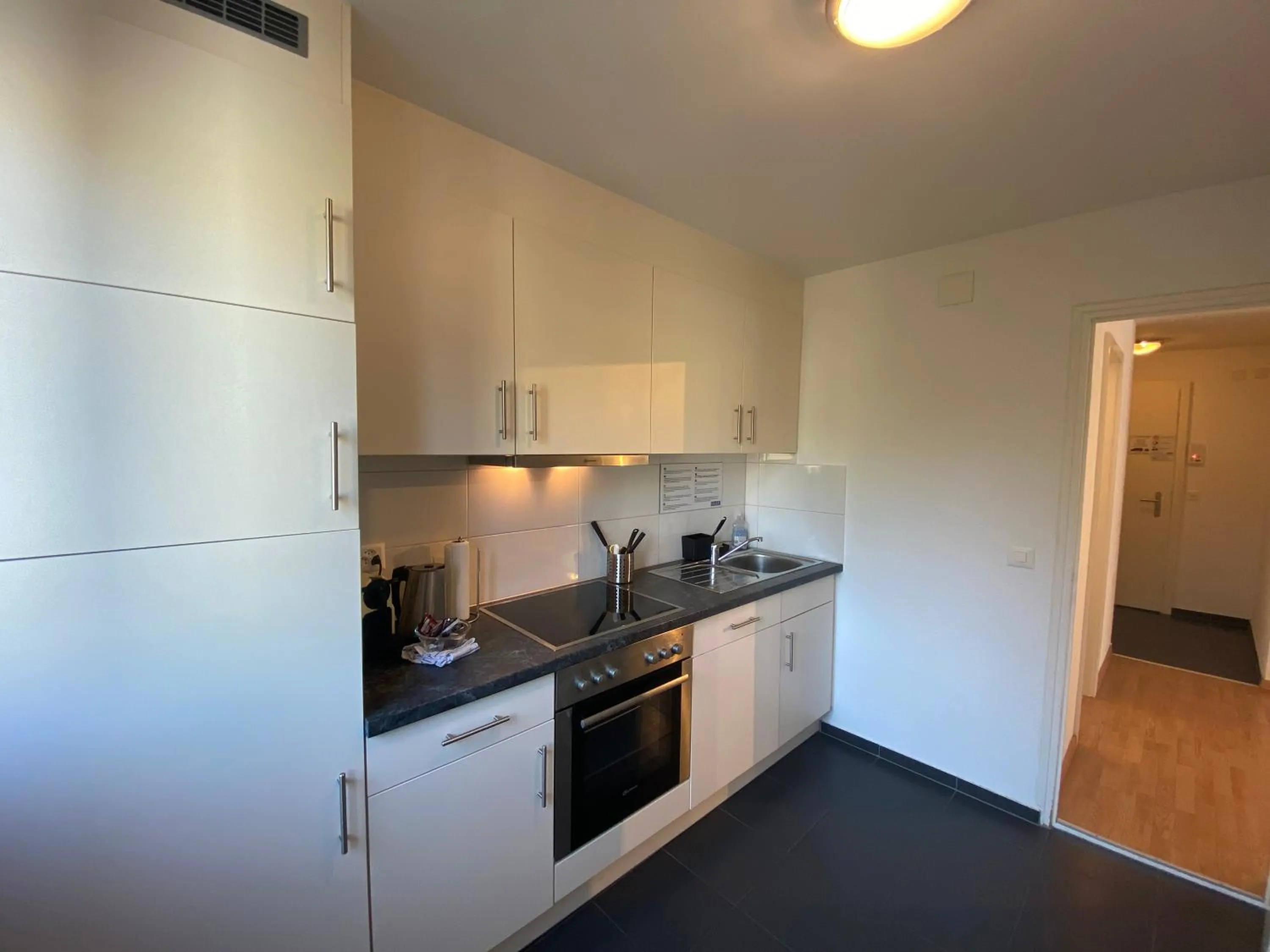 Kitchen or kitchenette in Galaxy Apartments Lucerne