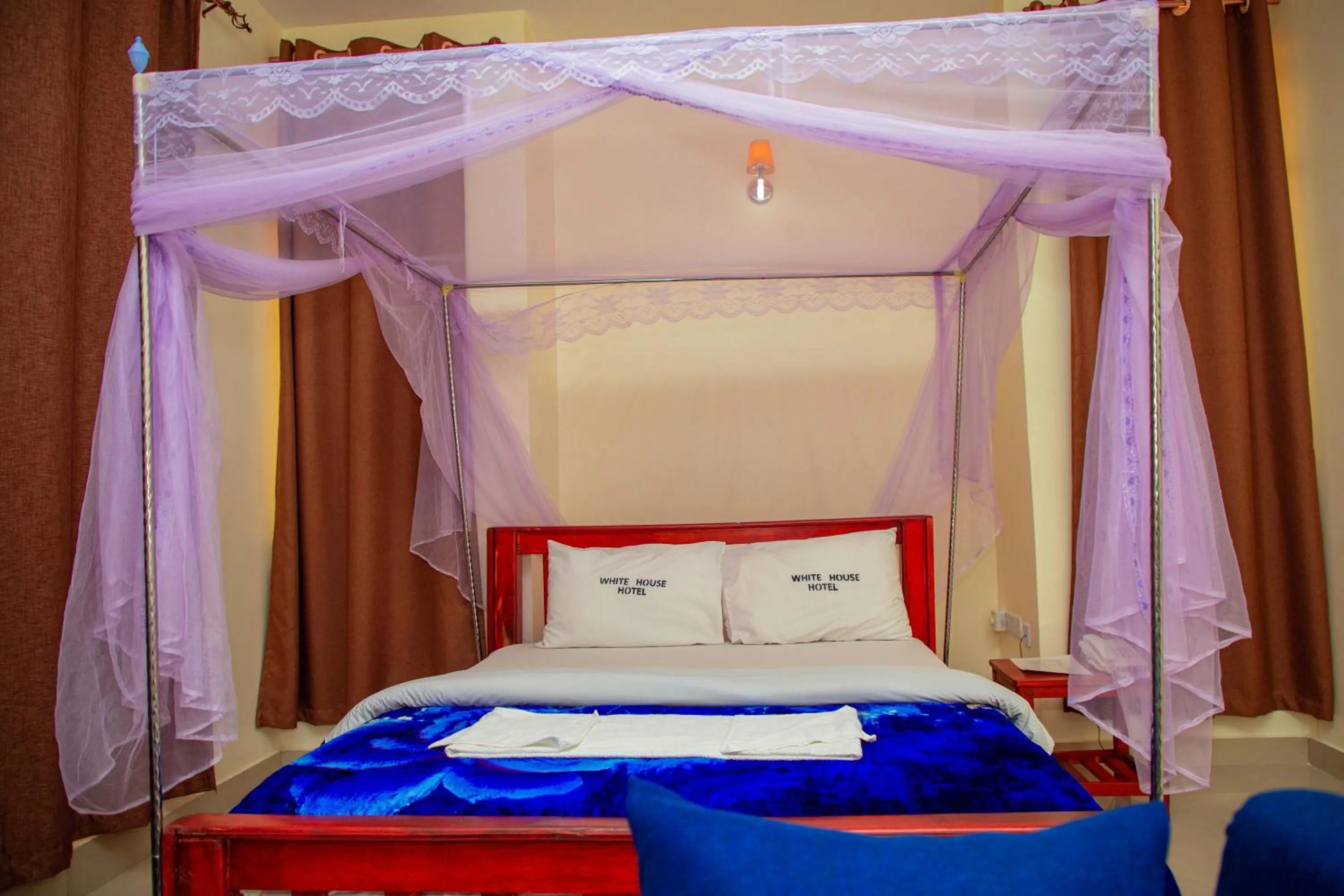 Bed in Kilimanjaro White House Hotel