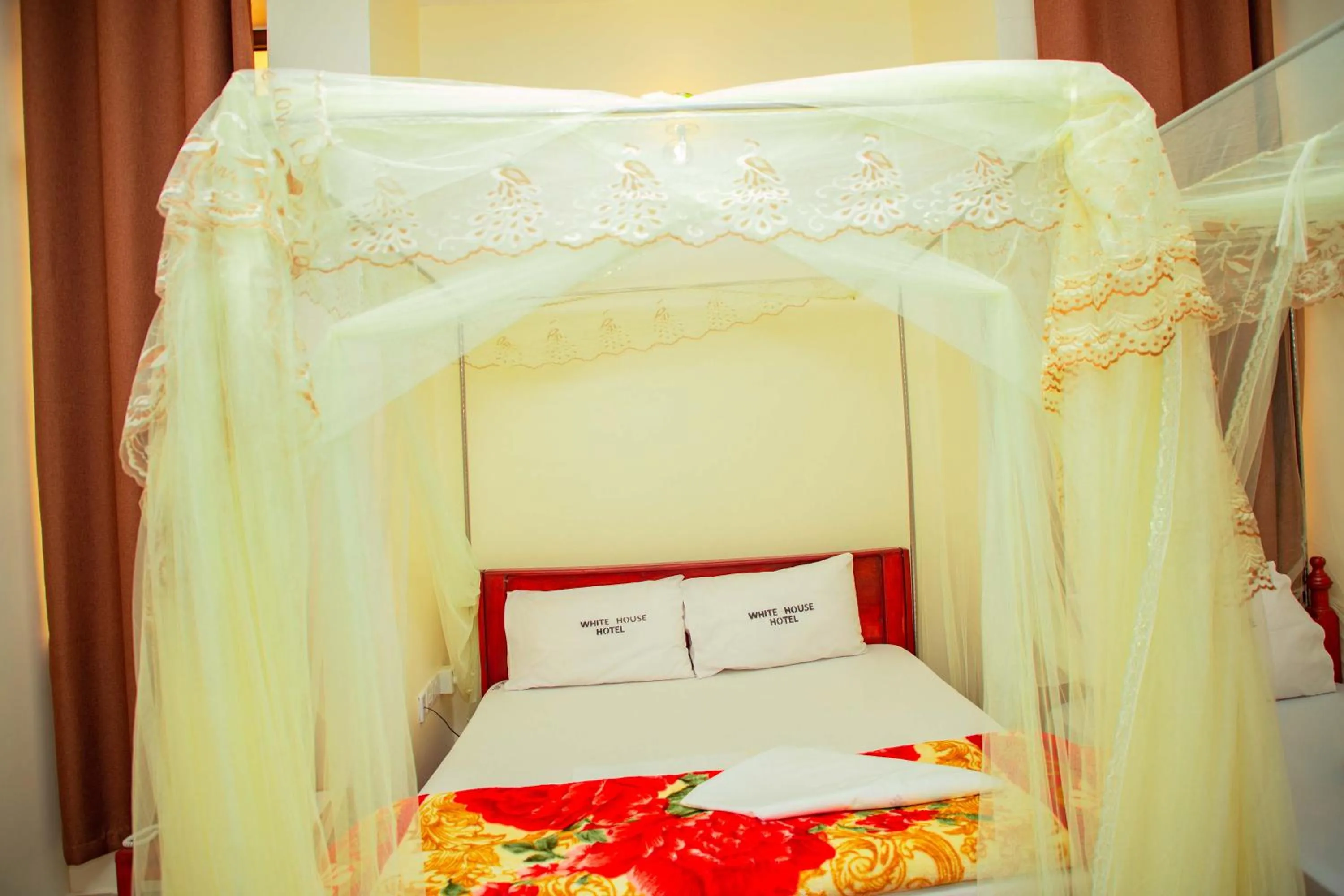 Bed in Kilimanjaro White House Hotel