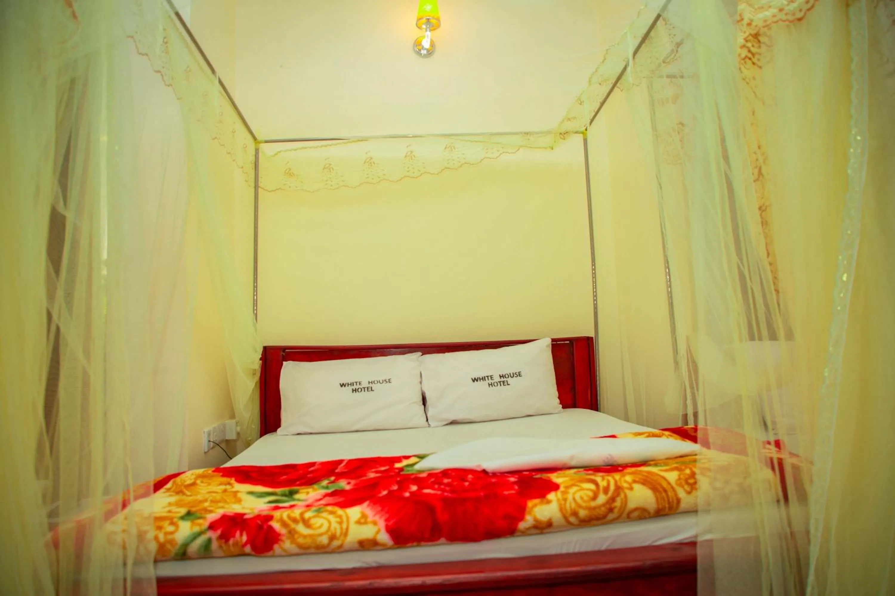 Bed in Kilimanjaro White House Hotel