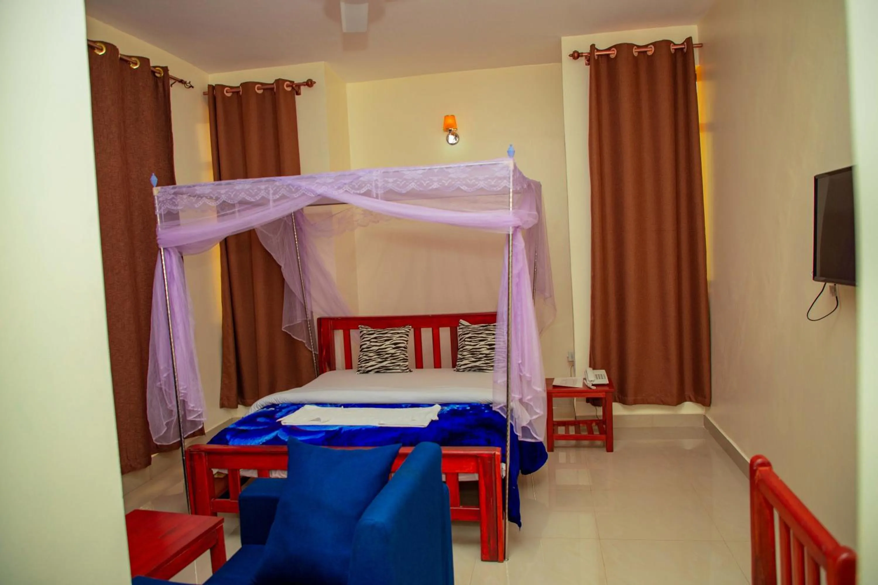 Bed in Kilimanjaro White House Hotel