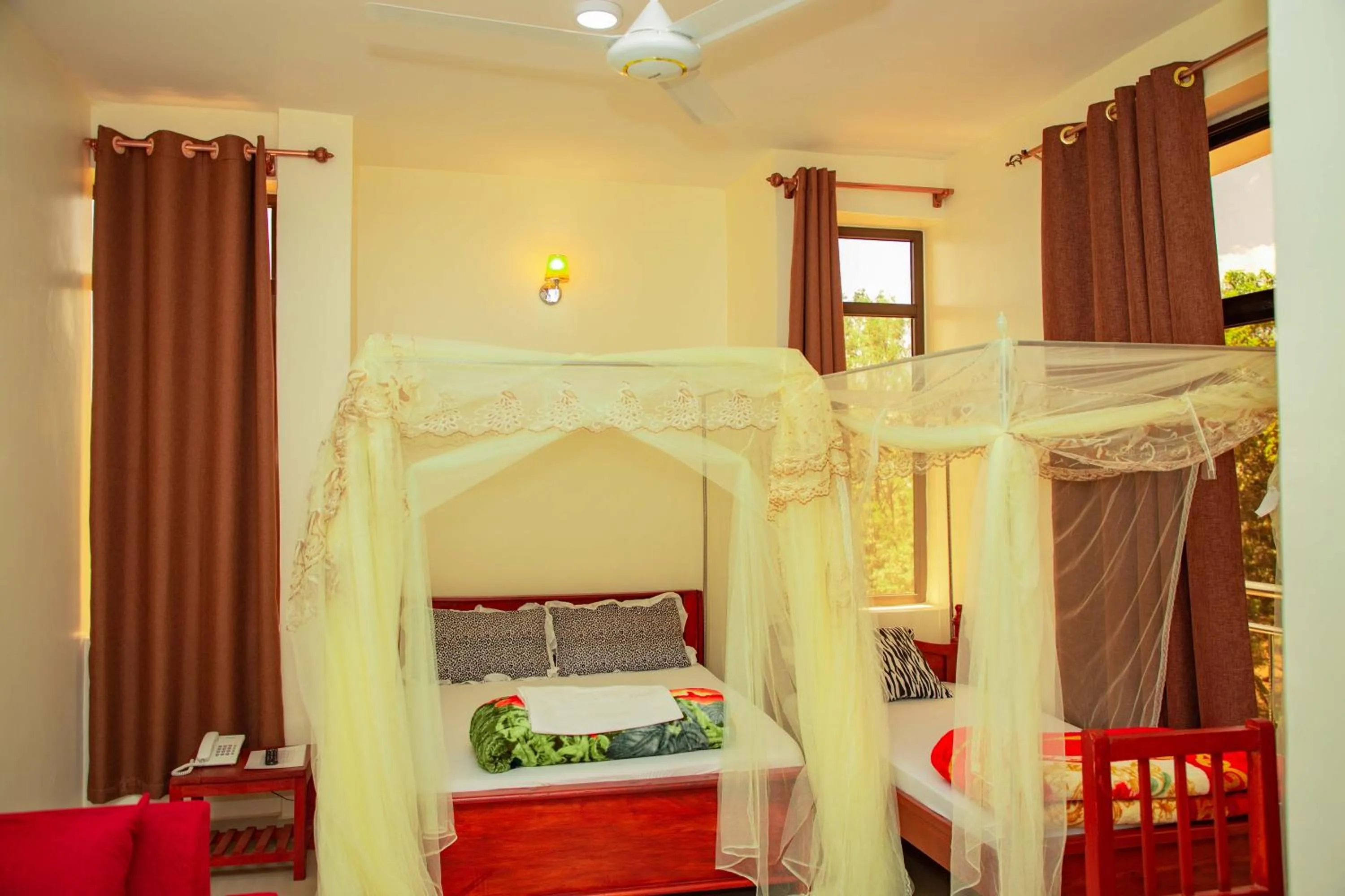 Bed in Kilimanjaro White House Hotel