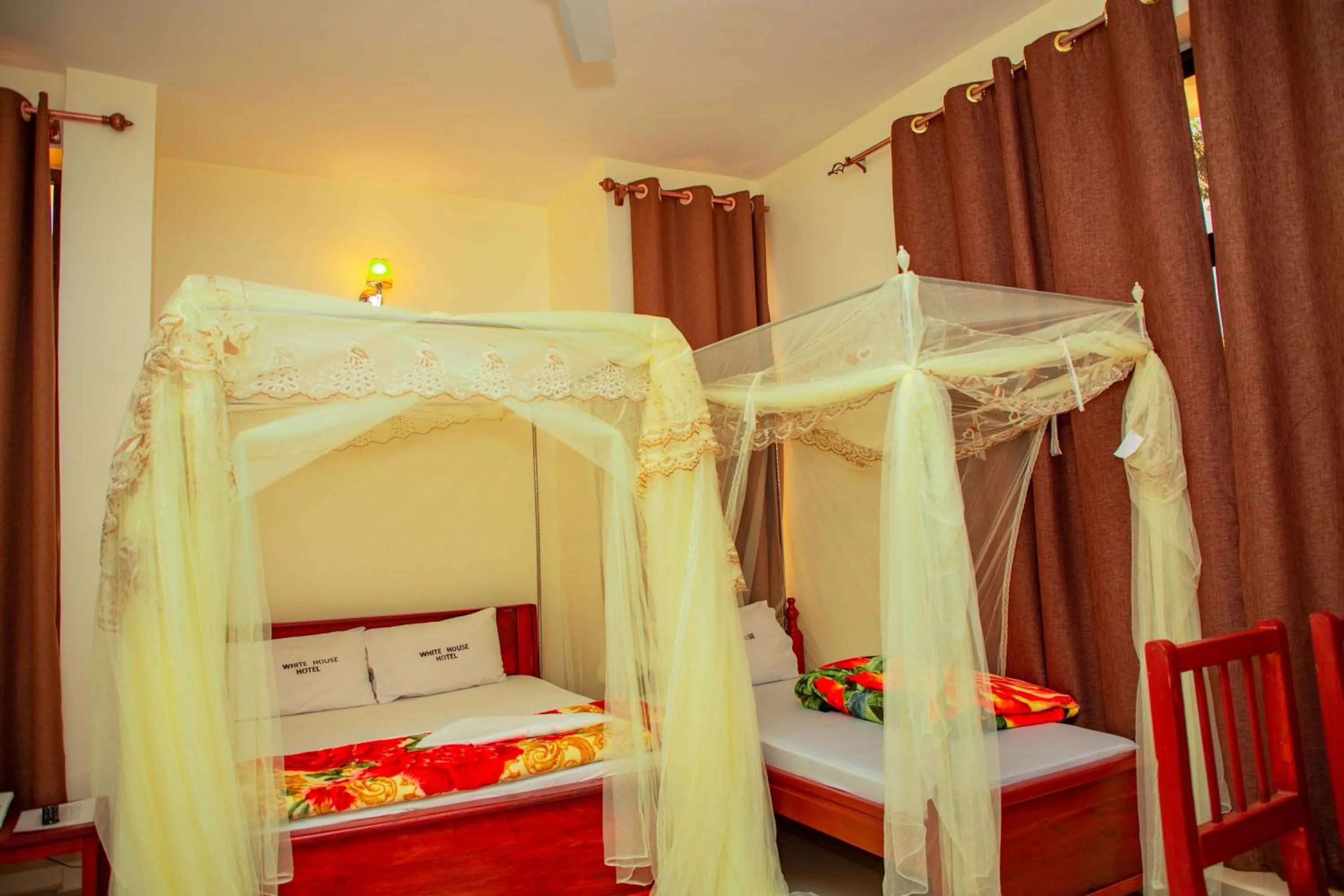 Bed in Kilimanjaro White House Hotel