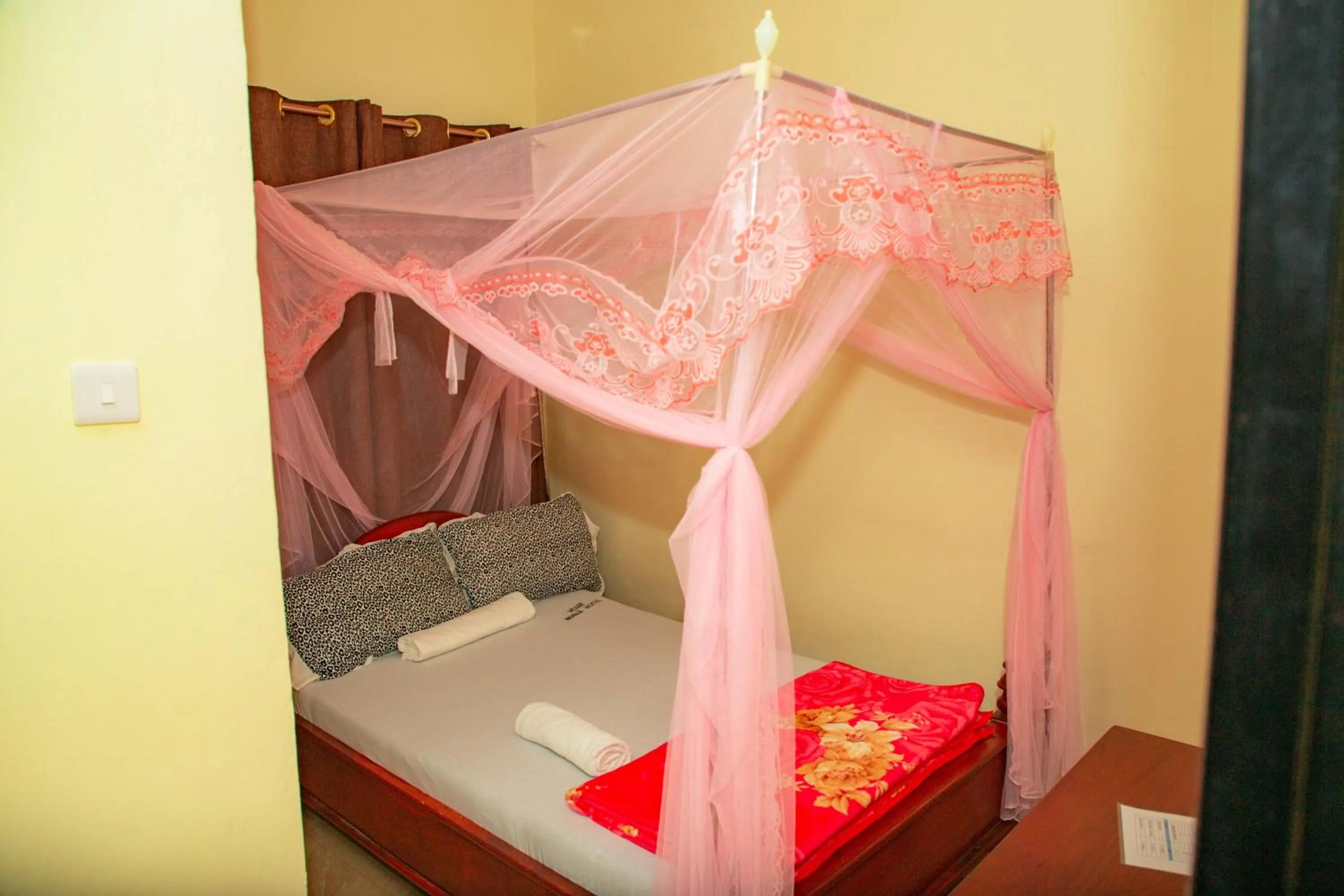 Bed in Kilimanjaro White House Hotel