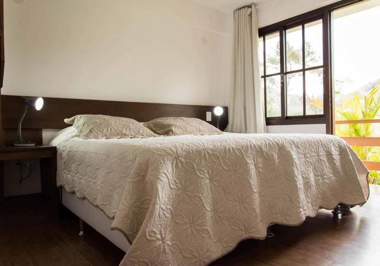 Bed in Pousada SPS Recanto da Serra