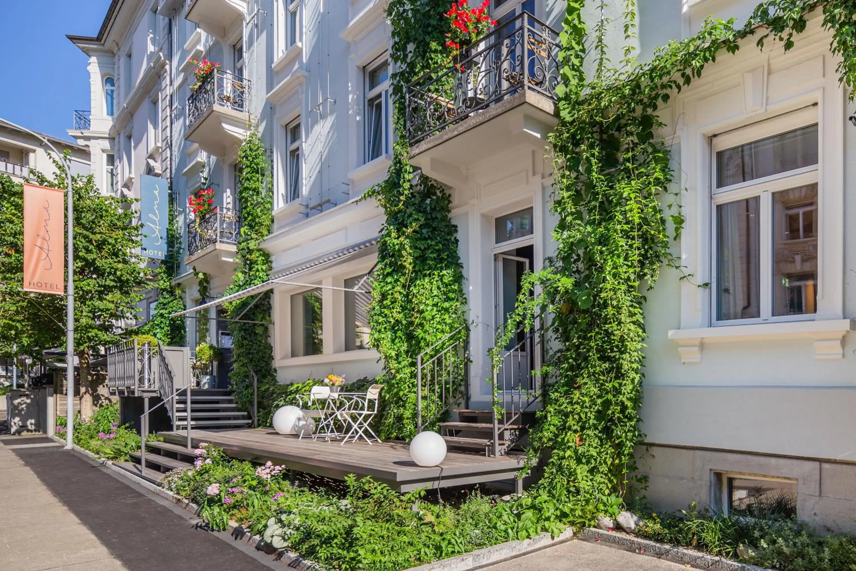 Property building in Alma Hotel - Boutique hideaway by the lake with rooftop and ladies-only wellness Property building in Alma Hotel - Boutique hideaway by the lake with rooftop and ladies-only wellness