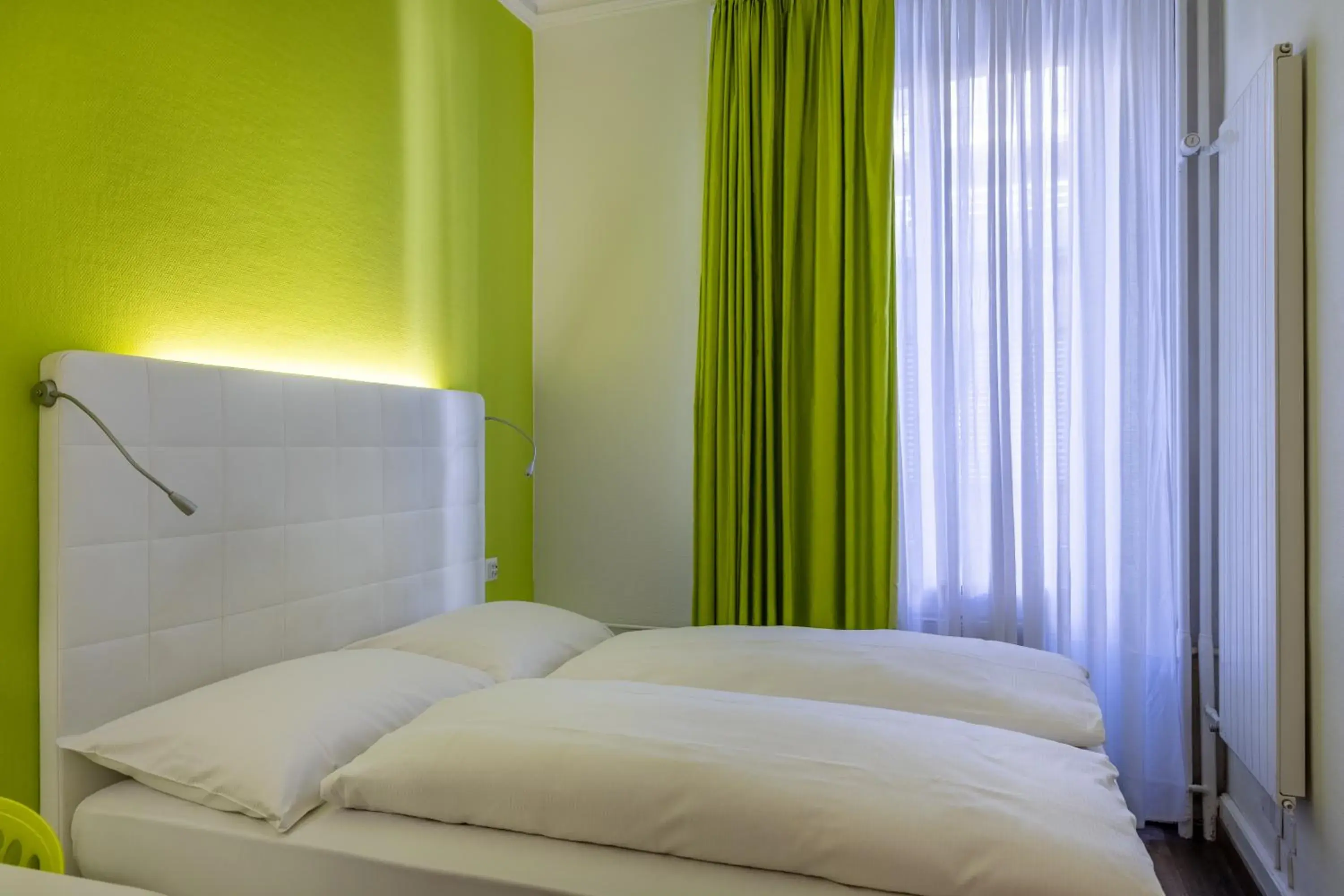 Bed in Hotel City Inn Basel Bed in Hotel City Inn Basel