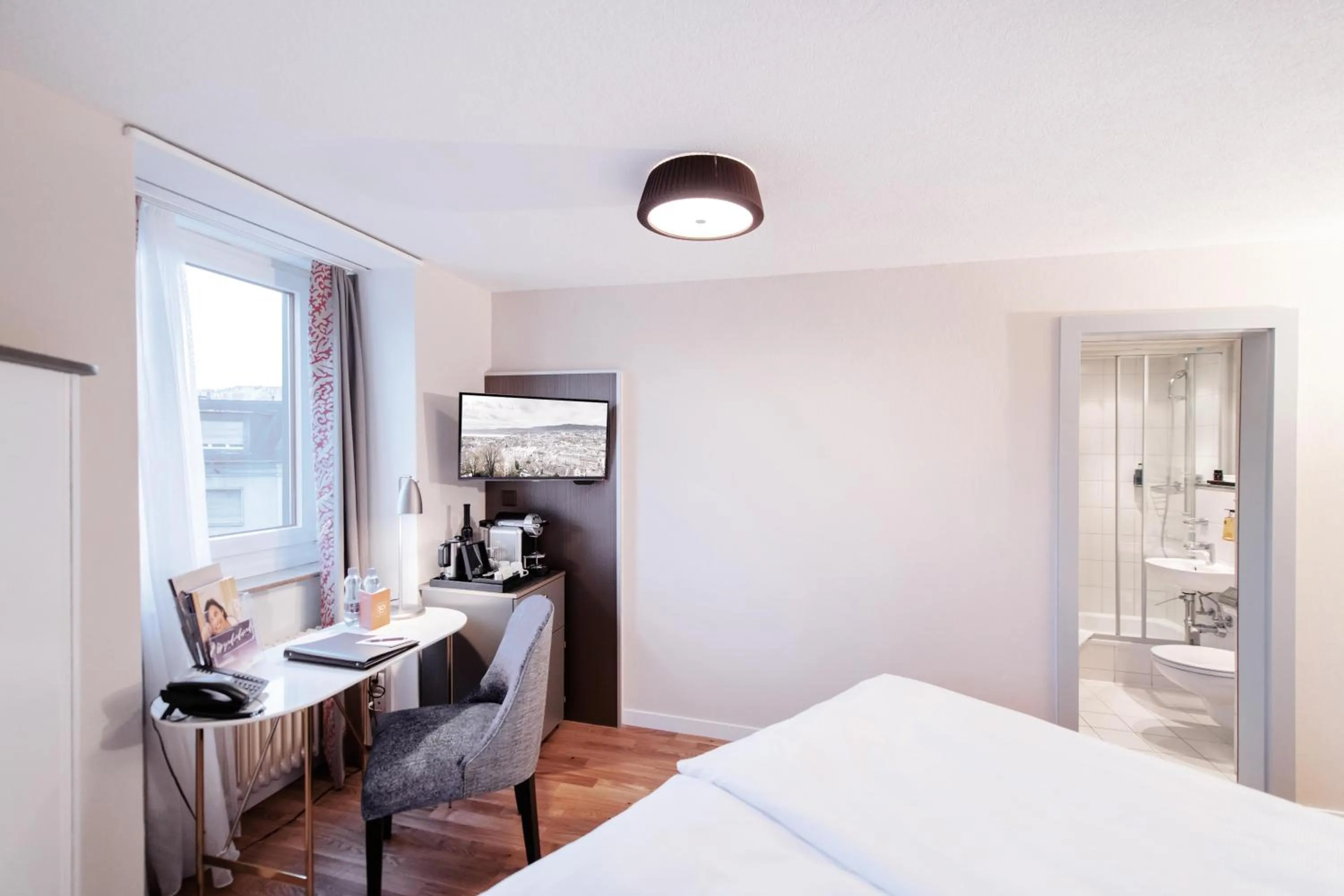 Bed in Sorell Hotel Rex Zürich