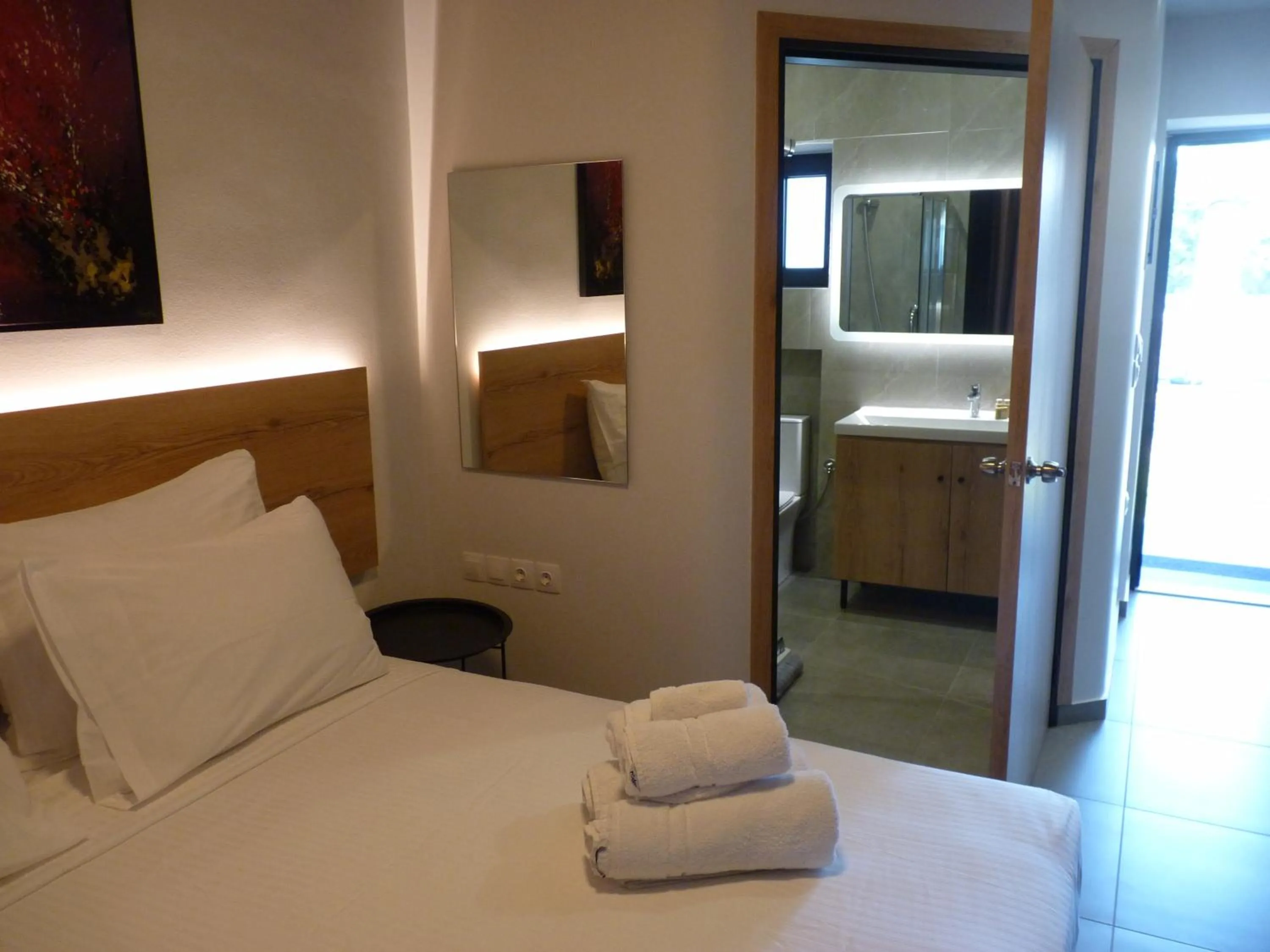 Bed in Comfort Suites & Rooms