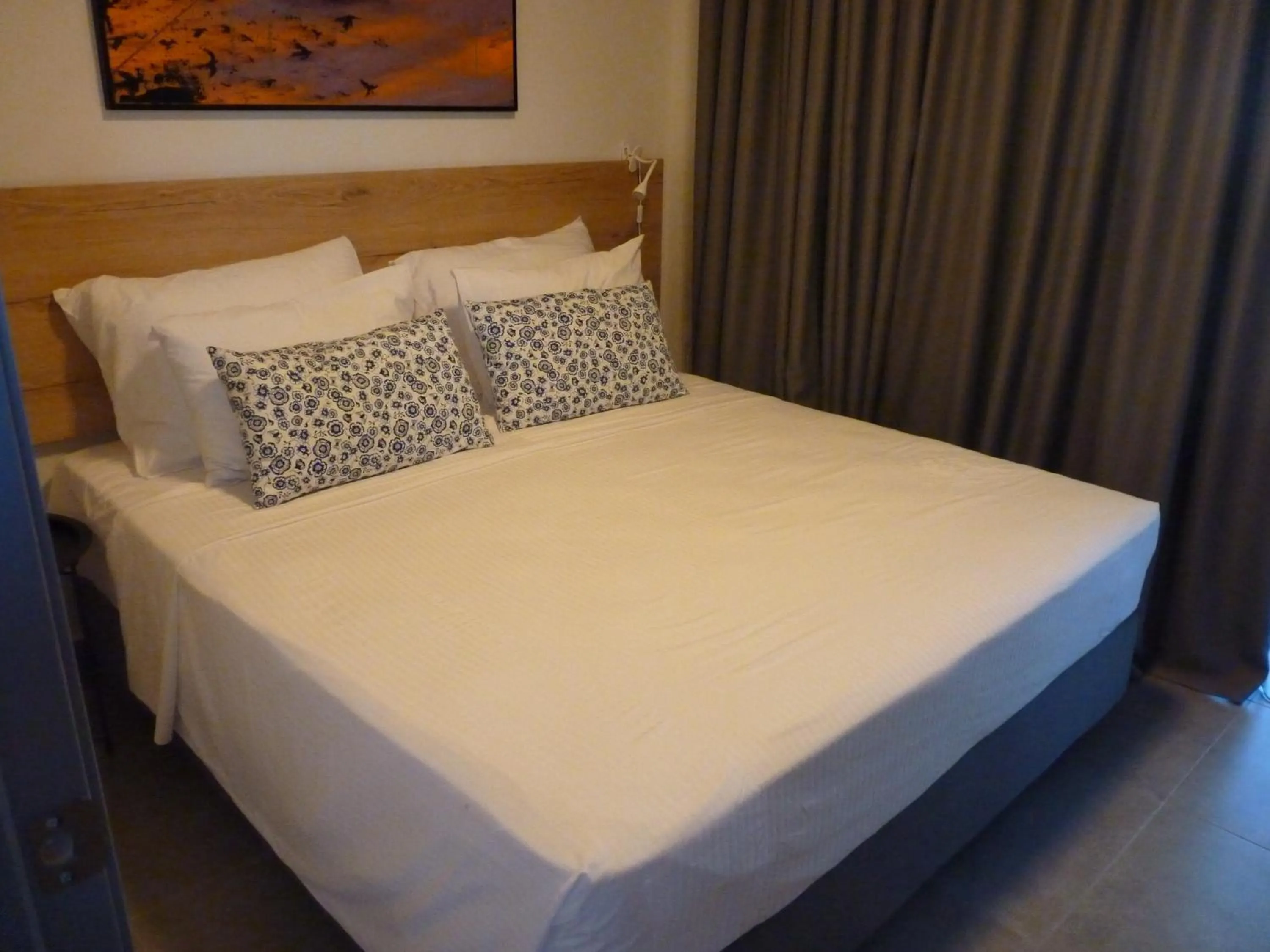 Bed in Comfort Suites & Rooms
