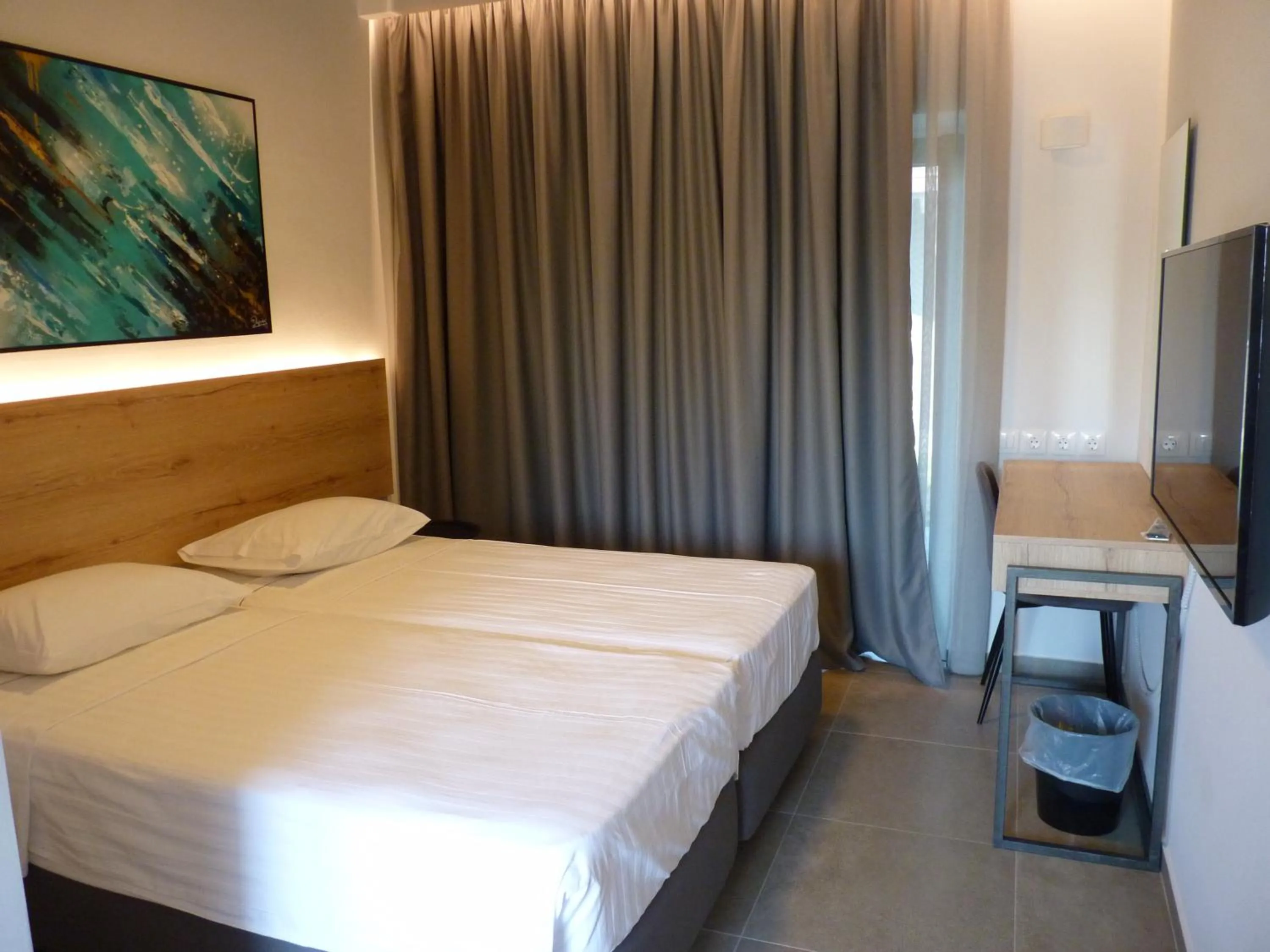 Bed in Comfort Suites & Rooms