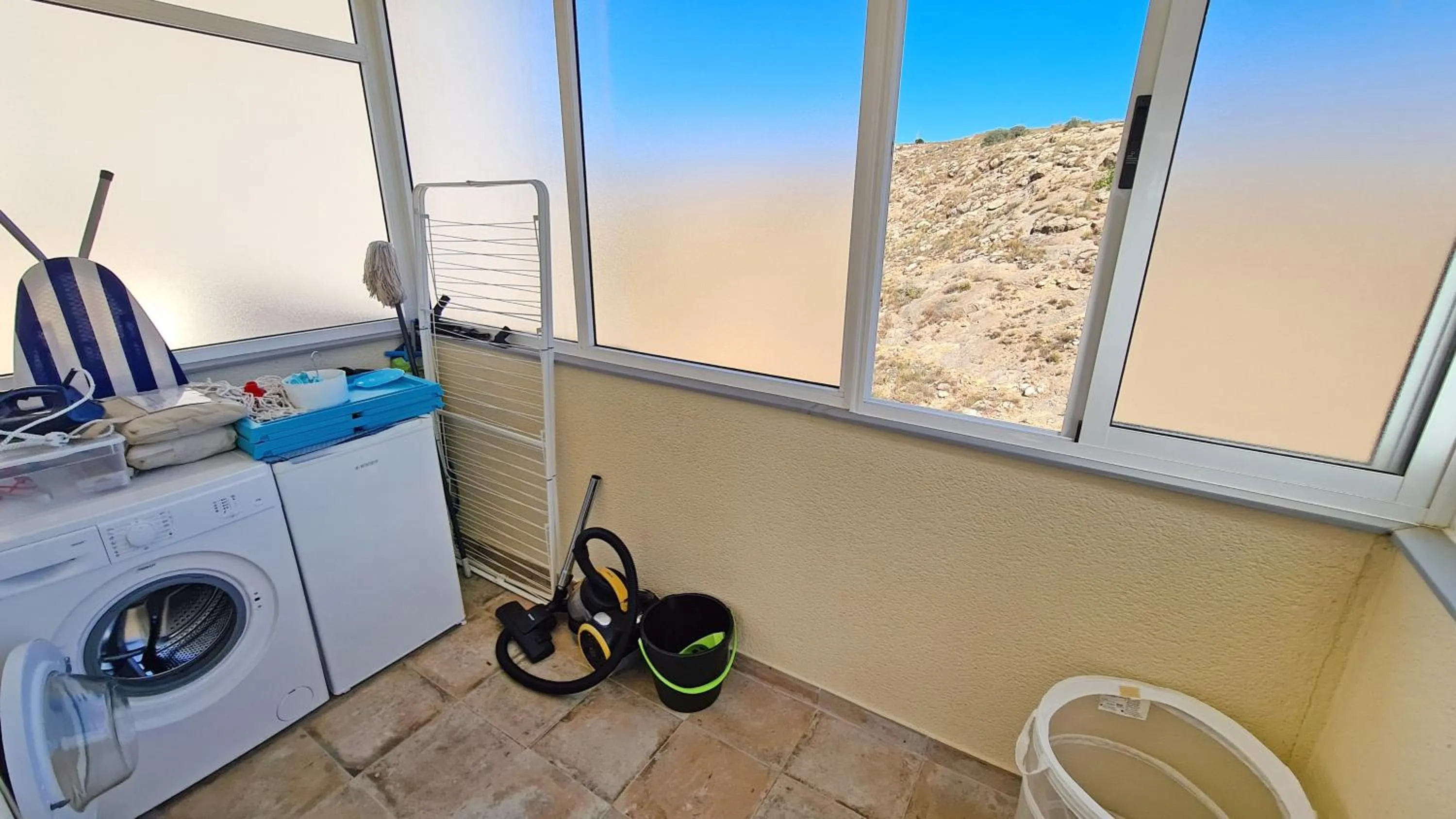 washing machine in Penthouse with Panoramic View by NRAS