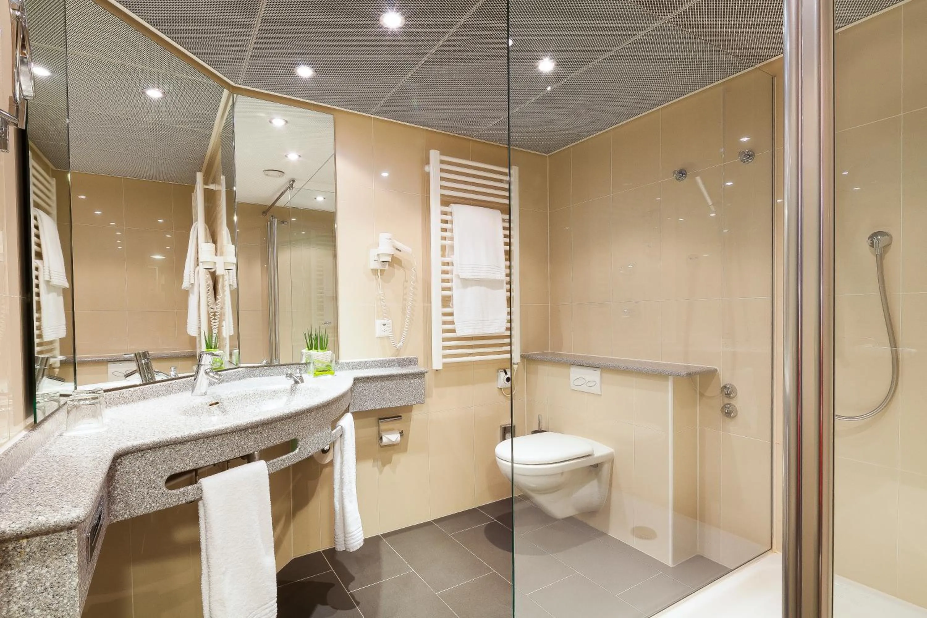 Bathroom in Ramada by Wyndham Baden Hotel du Parc